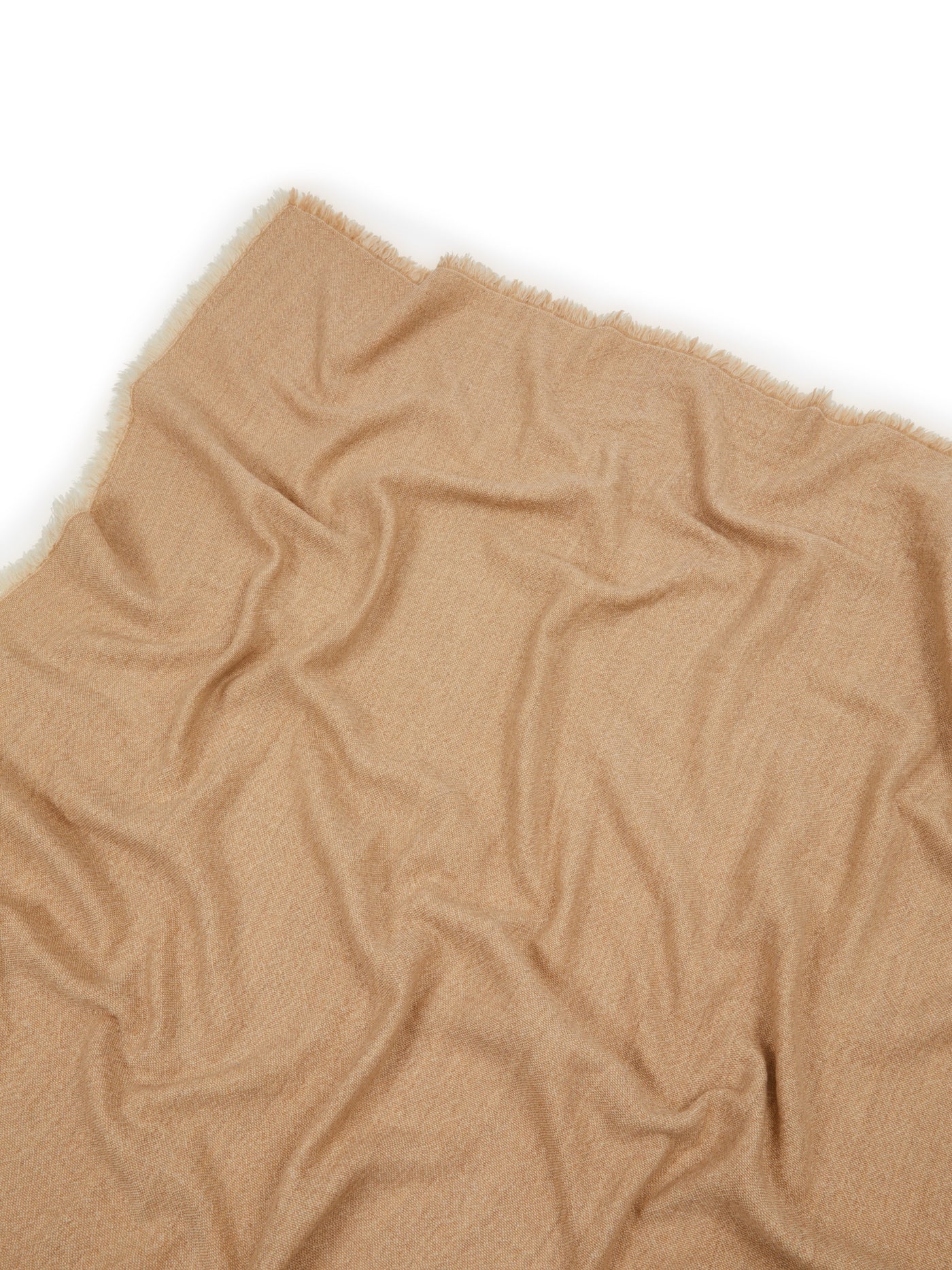 Lanerossi Zebio throw in camel, close-up showing soft draped fabric with frayed edge detail.