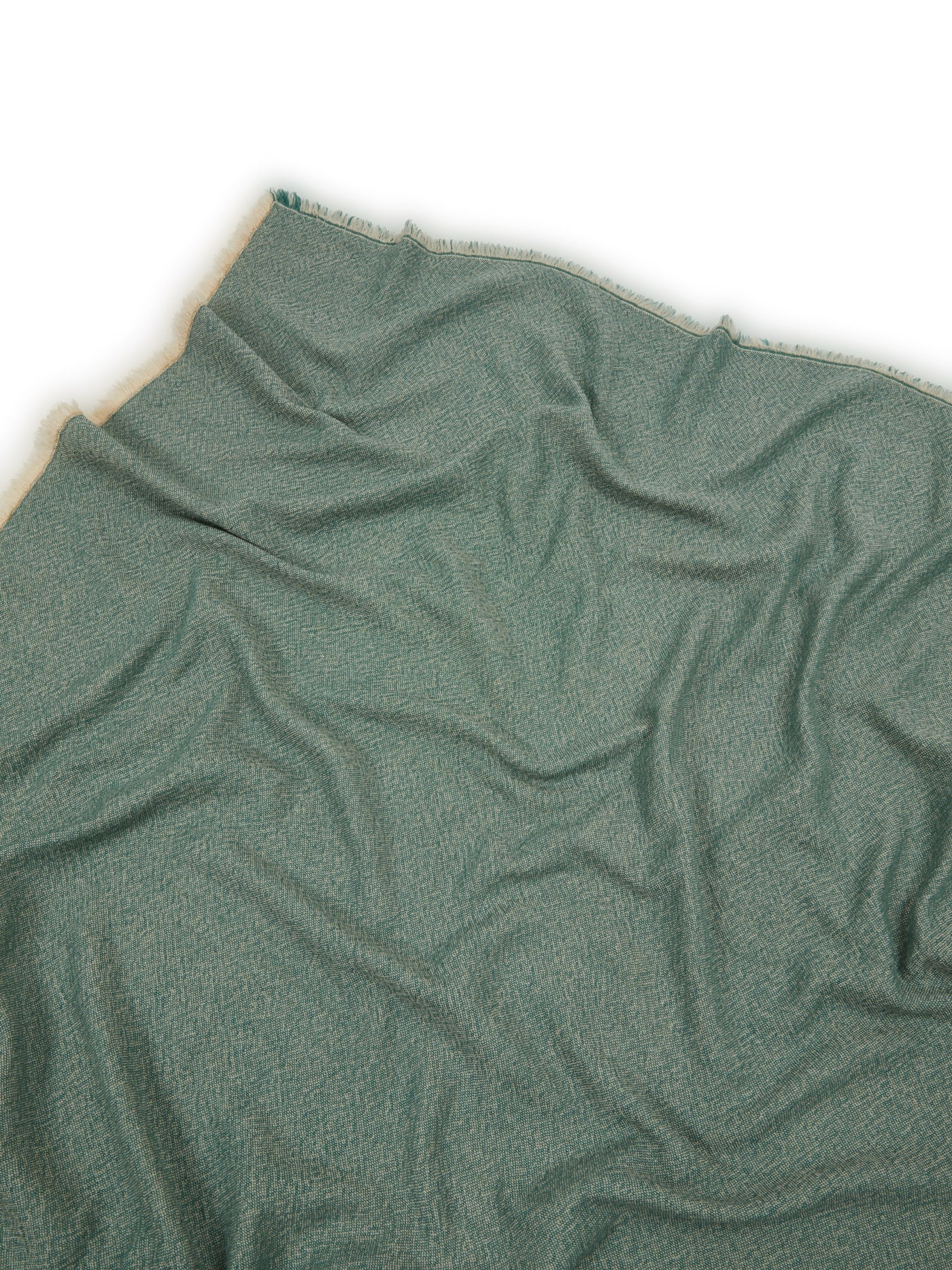 Close-up of Lanerossi Zebio throw in sage green, showing soft draped texture and fringe trim.