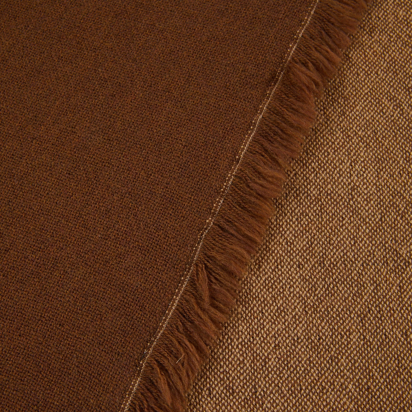 Close-up of Lanerossi Zebio throw's fringed edge, showing tobacco and amber reversible weave.