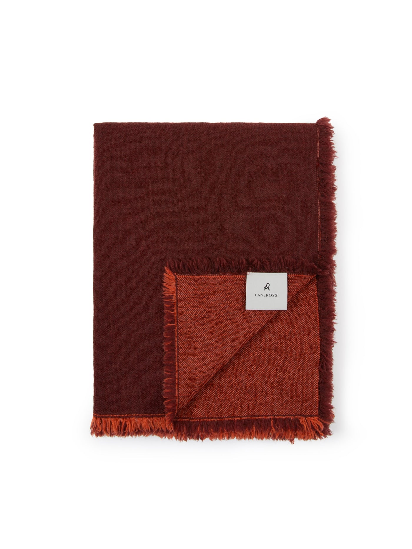 Folded Lanerossi Zebio throw showing reversible rust and burgundy sides with fringe trim.