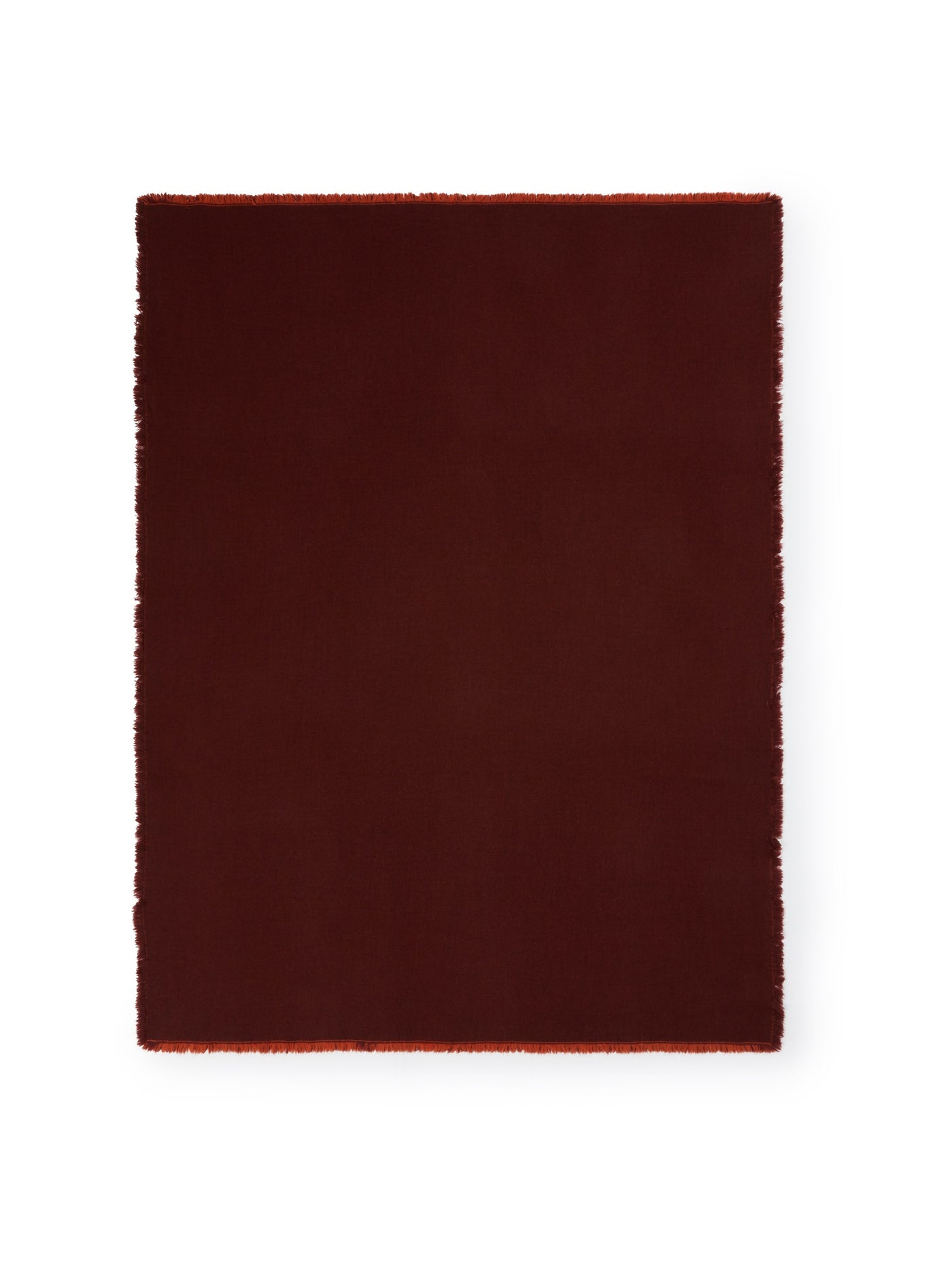 Lanerossi Zebio throw in burgundy with fringe trim detail on all edges.