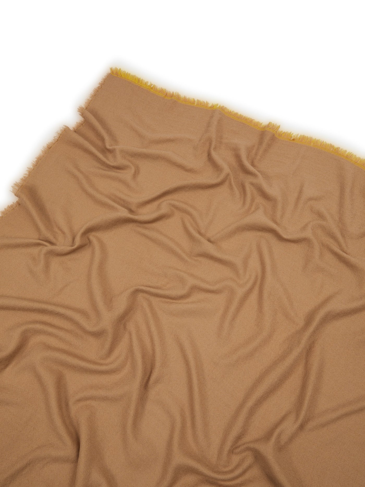 Camel throw with mustard fringe trim, draped to show soft woven texture.