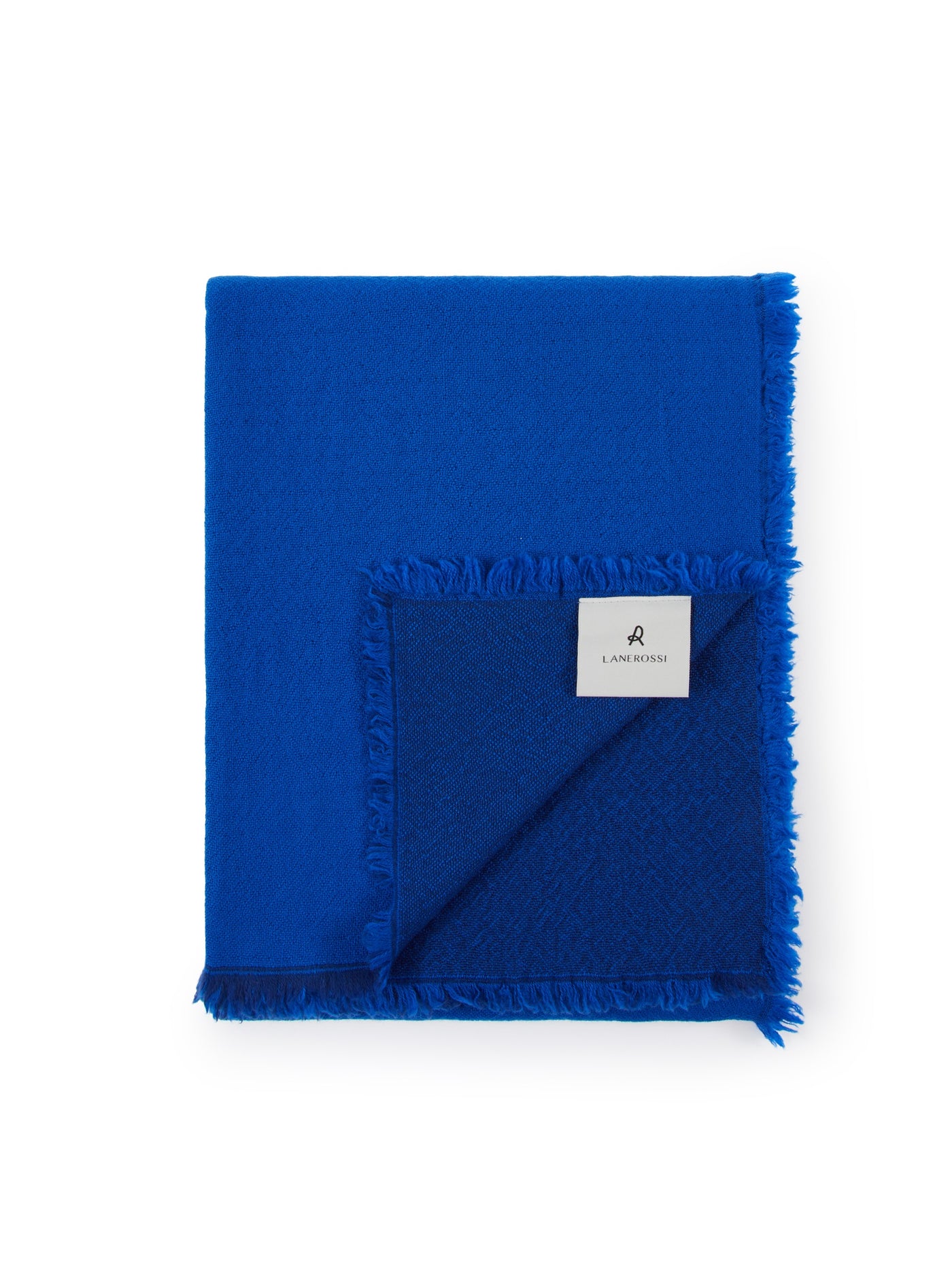 Lanerossi Zebio throw folded flat, cobalt blue with fringe trim and woven label.