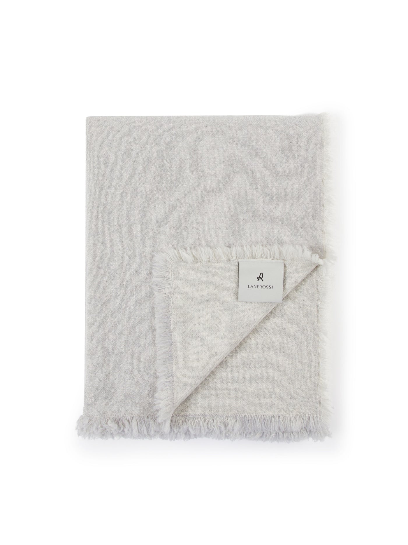 Folded ivory Lanerossi Zebio throw with fringe trim and woven label visible.