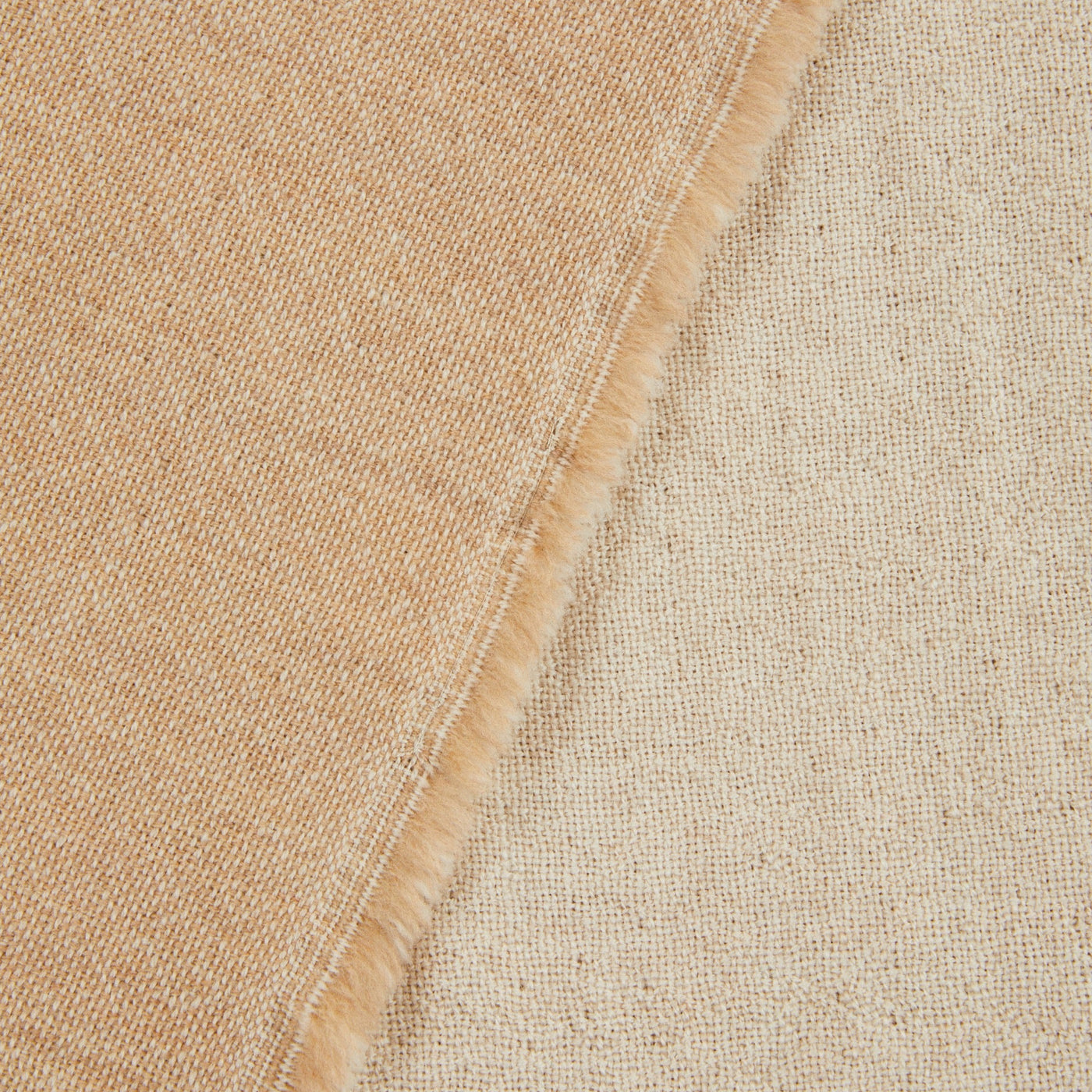 Close-up of Lanerossi Zebio blanket hem, showing camel wool weave and contrast edge stitching.