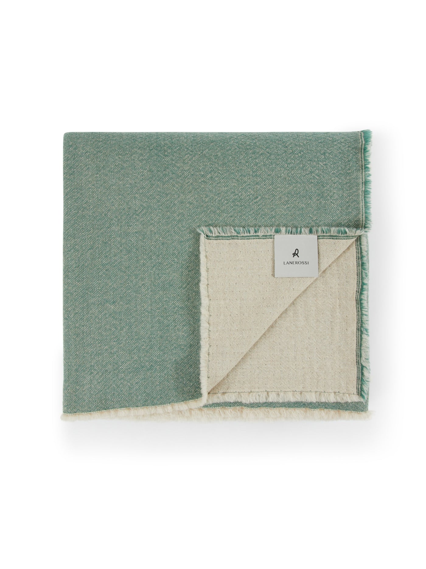 Lanerossi Zebio blanket folded, showing sage green face and natural ivory reverse with fringe trim.