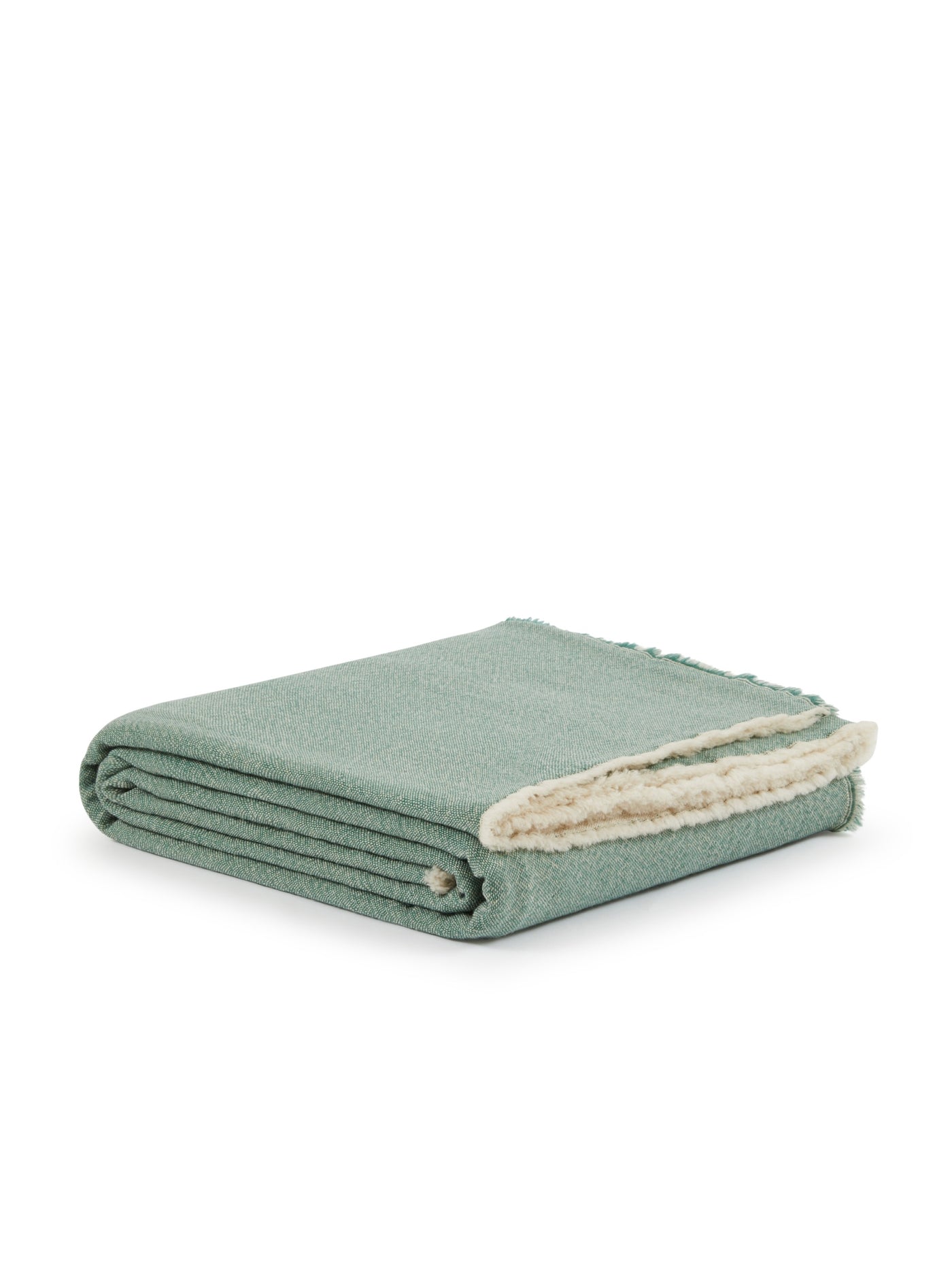 Lanerossi Zebio blanket folded, sage green boucle with ivory sherpa reverse visible at corner.