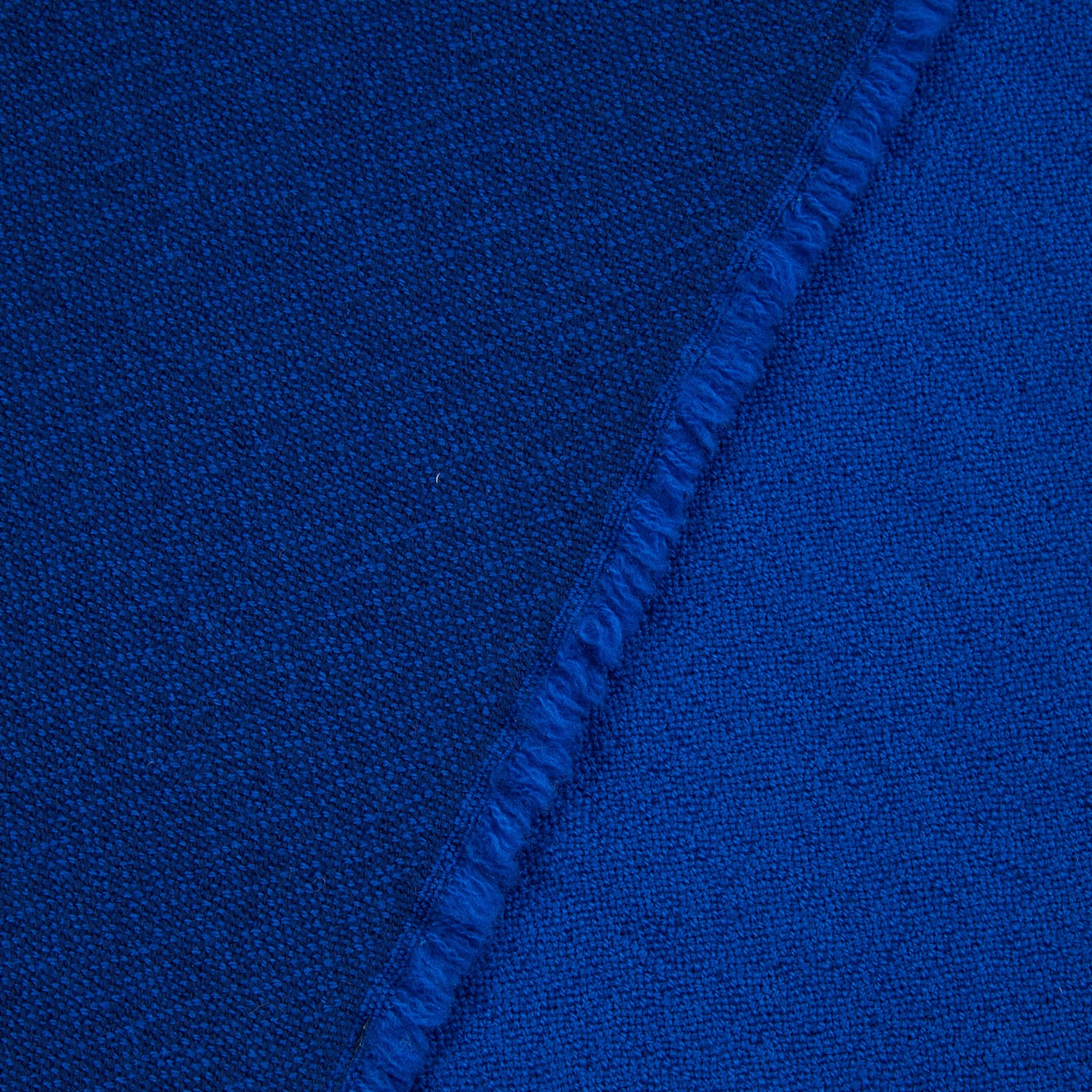 Close-up of Lanerossi Zebio blanket in cobalt blue, showing fringed edge detail.
