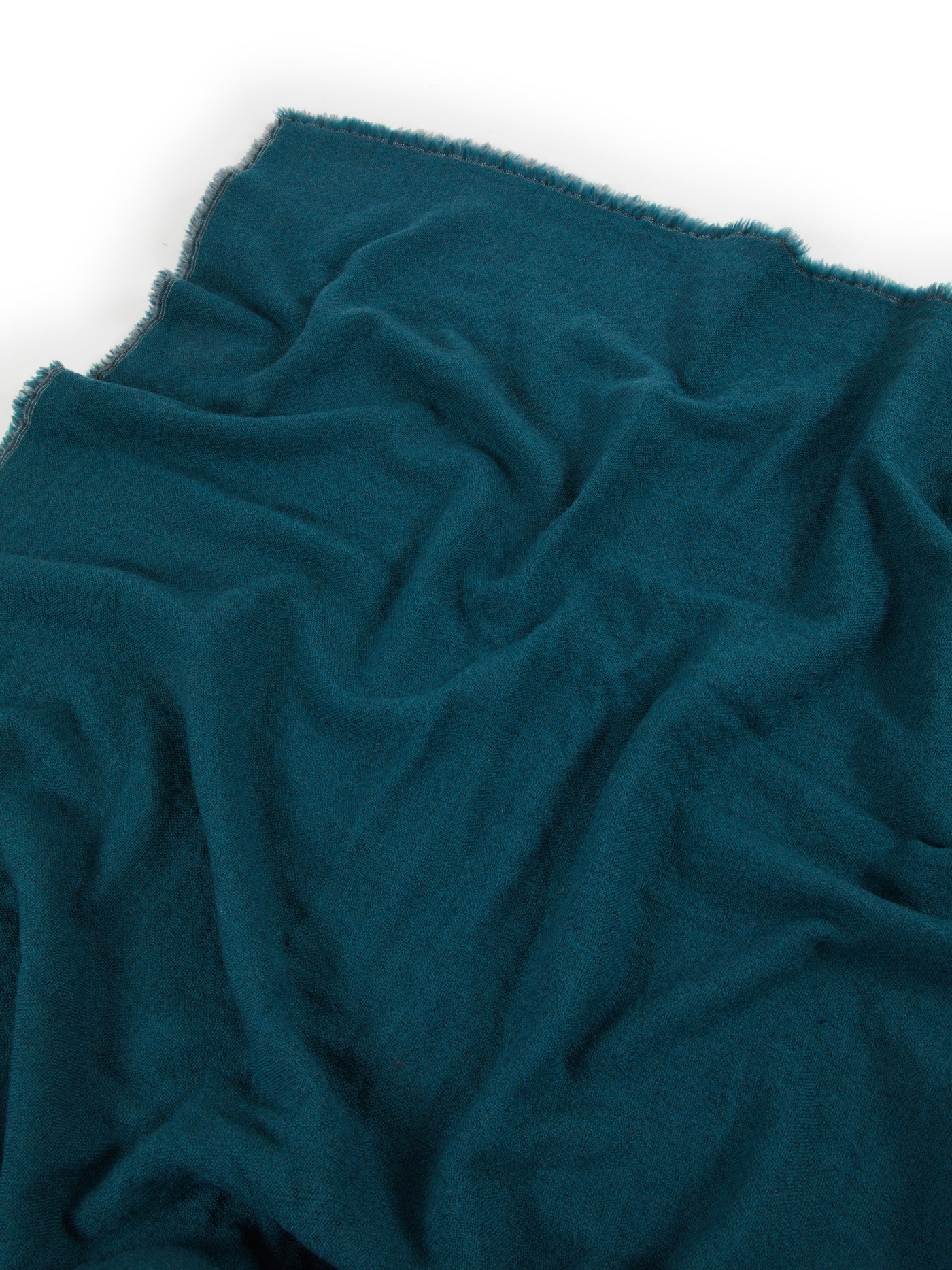 Teal Lanerossi Zebio blanket close-up showing soft brushed texture and frayed edge detail.