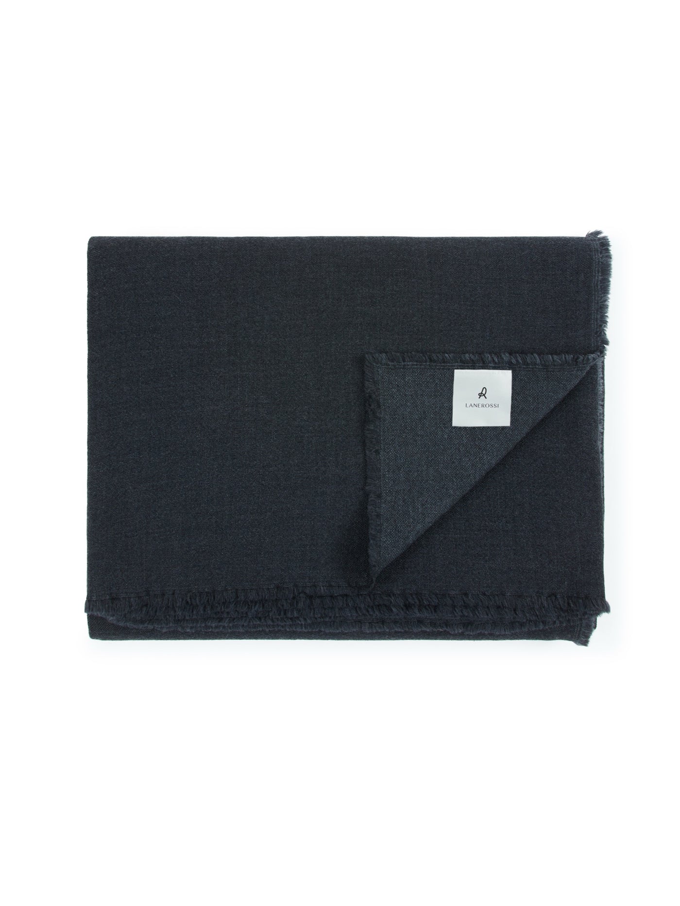 Lanerossi Zebio blanket folded in midnight, showing frayed edges and woven label.