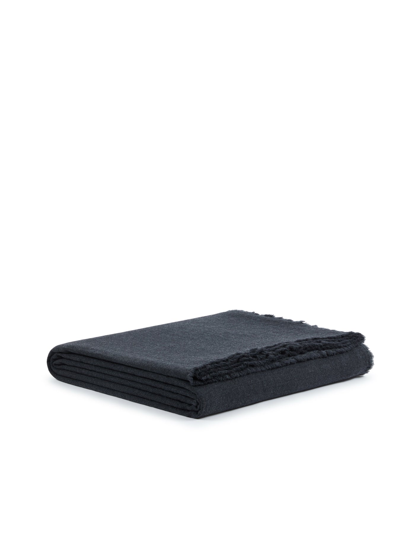 Charcoal blanket folded flat, fringe trim visible along one edge.