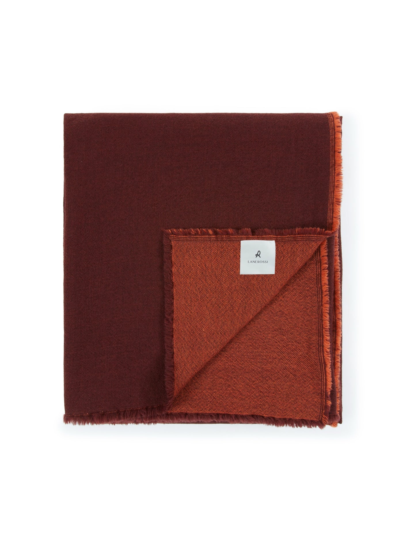 Folded Lanerossi Zebio blanket showing reversible burgundy and rust colorways with fringe trim.