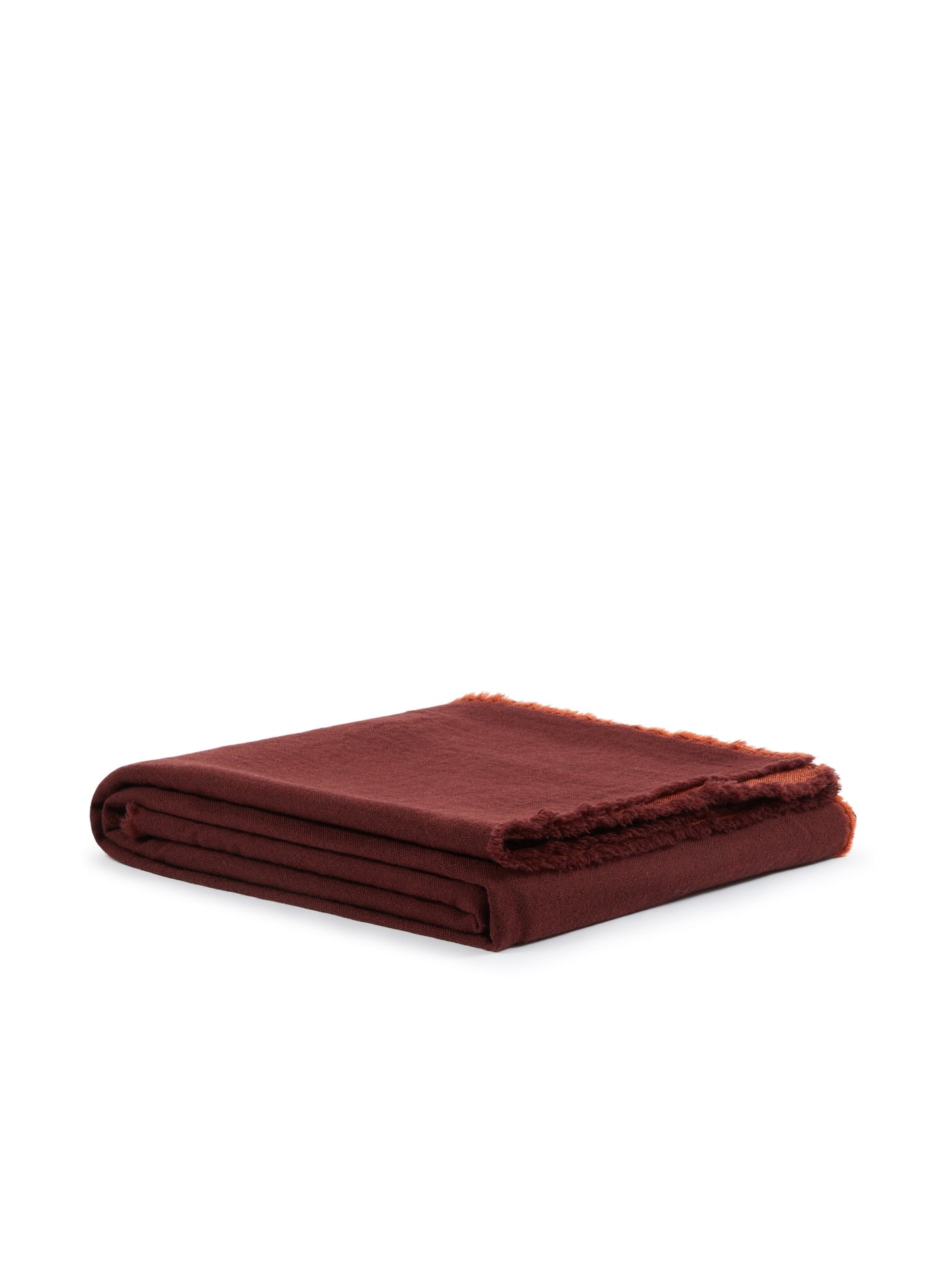 Lanerossi Zebio blanket folded in burgundy, showing fringe trim detail along one edge.