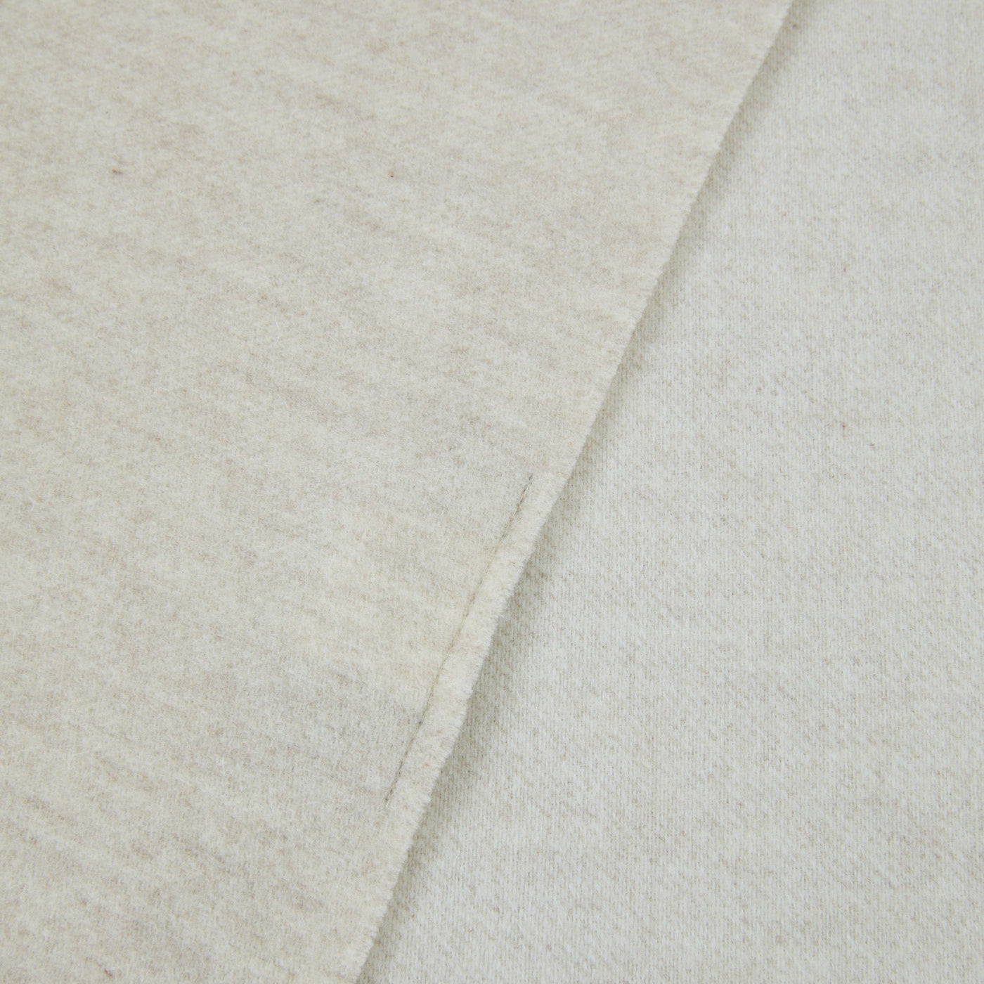 Lanerossi Alashan throw in ivory, close-up of folded edge showing soft wool texture.