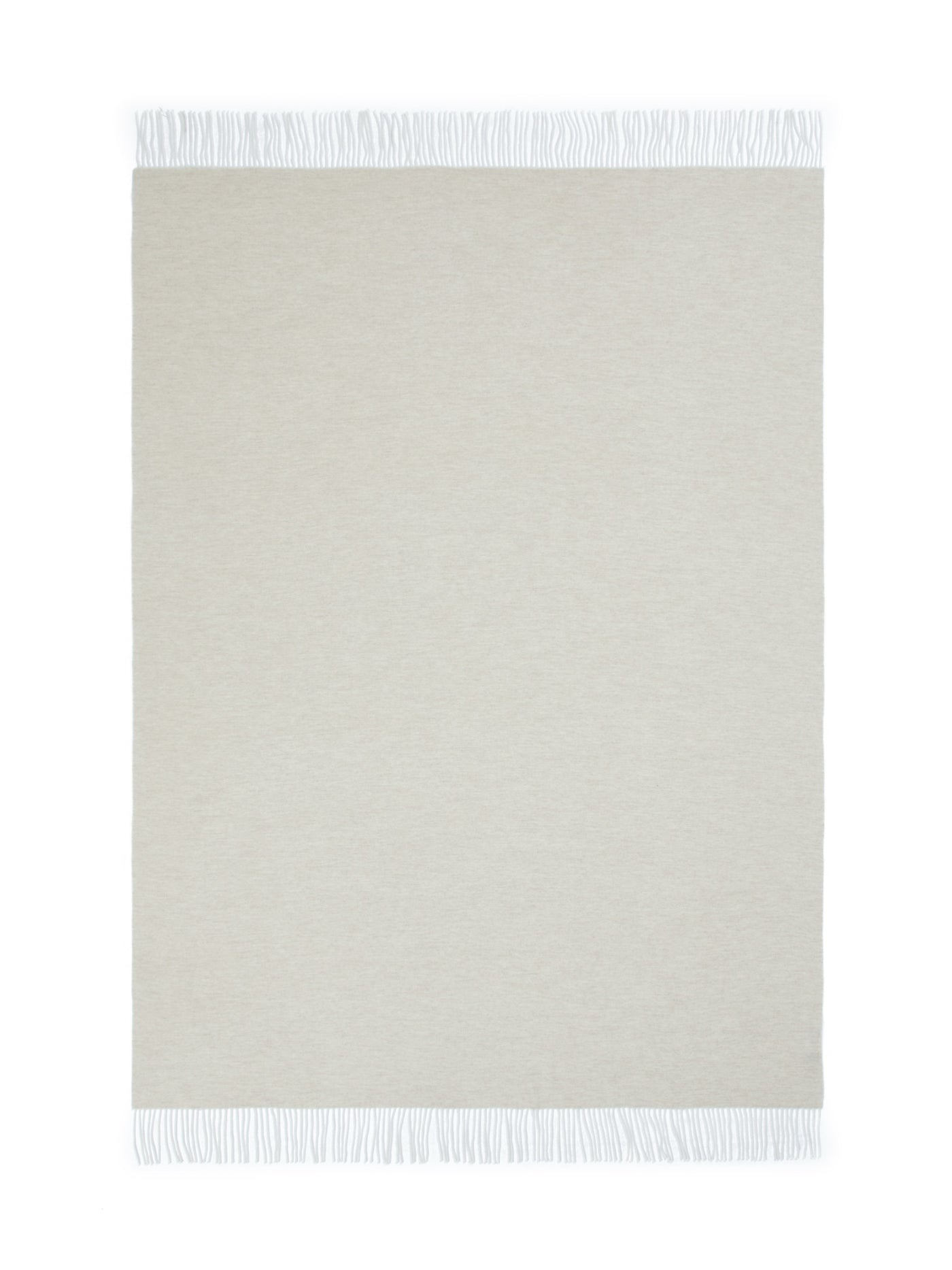 Ivory throw laid flat, showing white fringe trim along top and bottom edges.