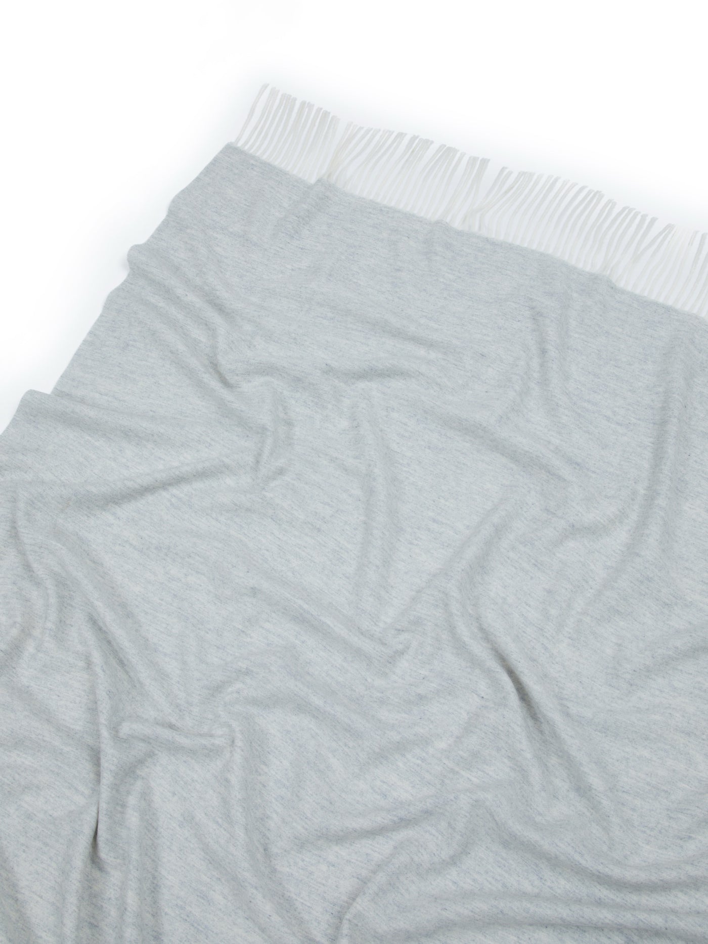Silver-grey Lanerossi Alashan throw with fringe trim, draped to show soft fabric texture.