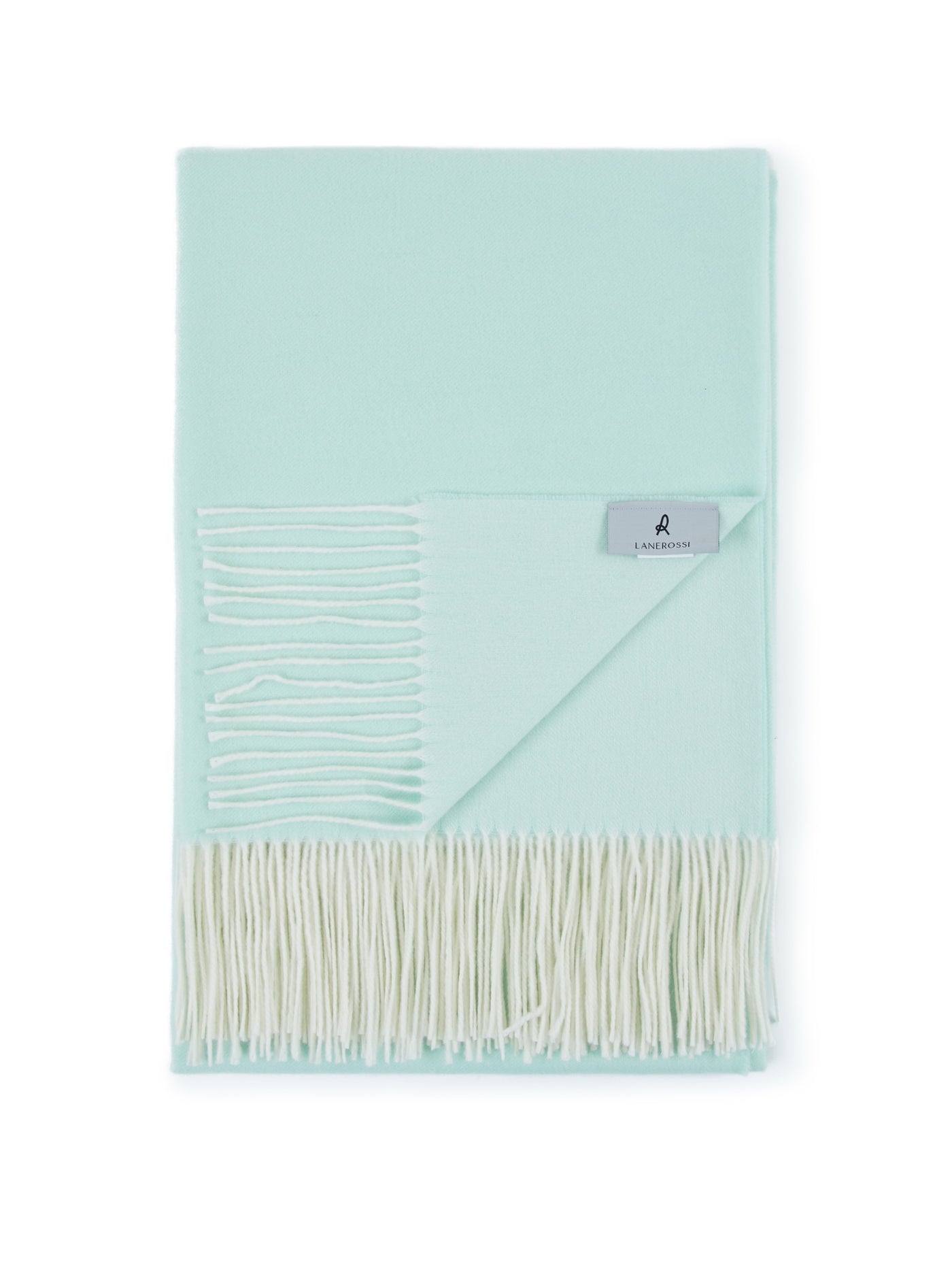 Lanerossi Alashan throw in mint, folded flat showing ivory fringe trim and brand label.