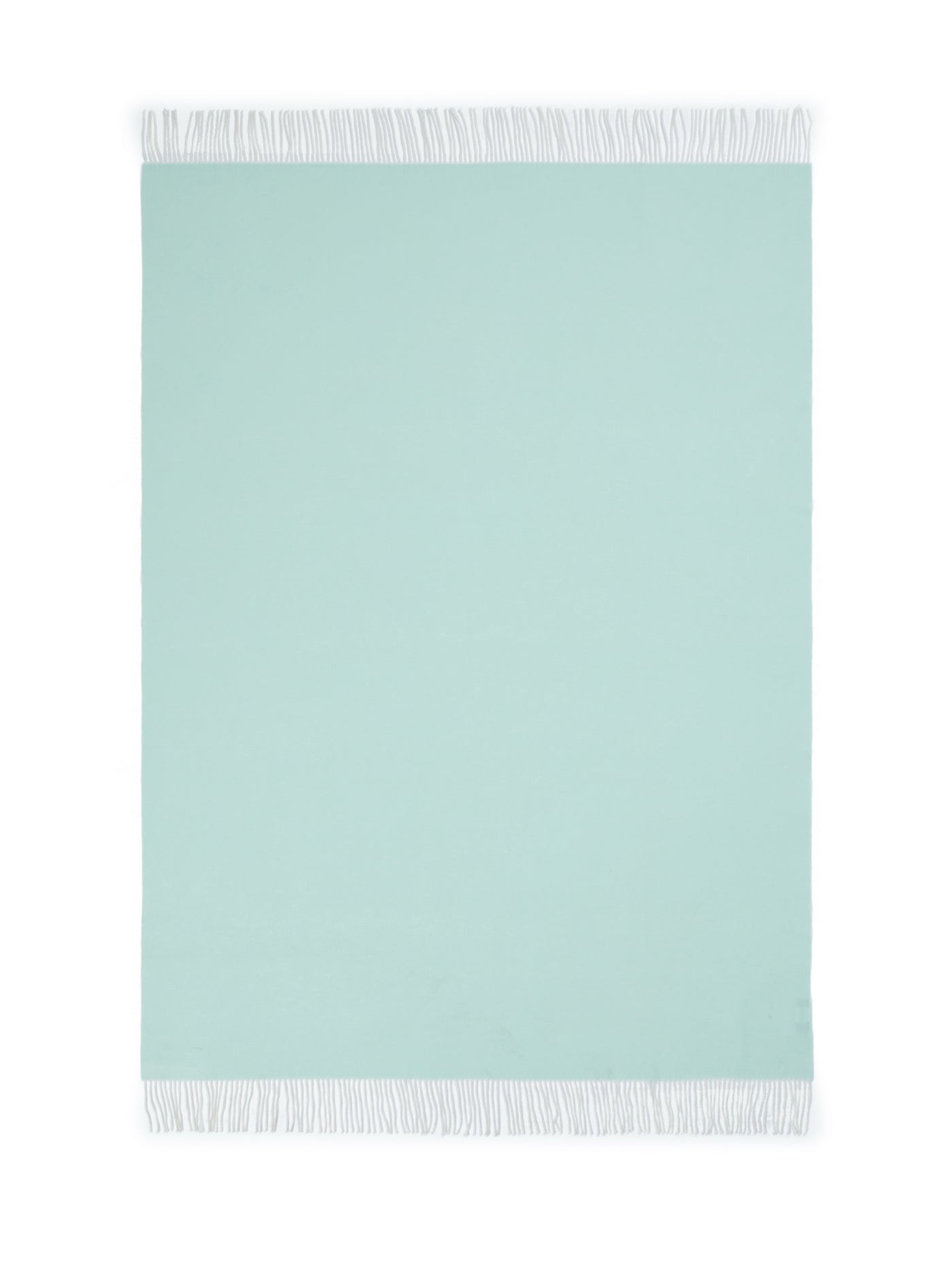 Lanerossi Alashan throw in mint with white fringe trim, flat lay view.