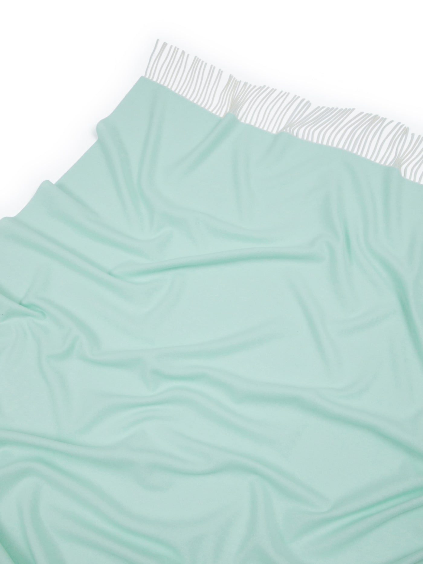 Lanerossi Alashan throw in mint, draped to show striped trim detail along top edge.