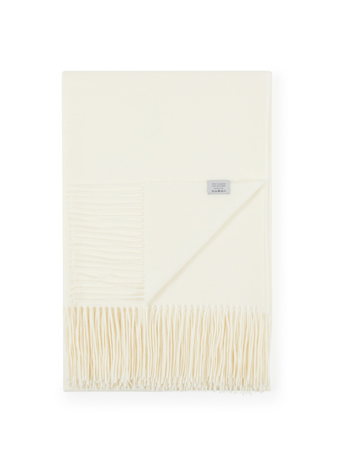 Ivory wool throw folded flat, showing fringe hem and woven texture detail at corner.