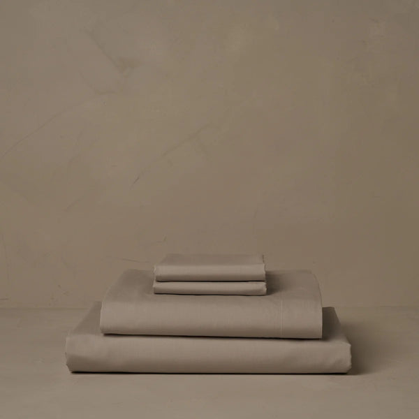 Photo of the Retiring Classic Percale | Sheet Set ensemble.