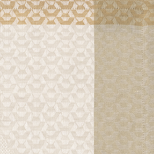 Close-up of ivory and gold jacquard weave with geometric floral pattern and contrast border.