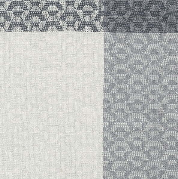 Close-up of ivory and slate blue woven jacquard pattern with geometric floral motif.
