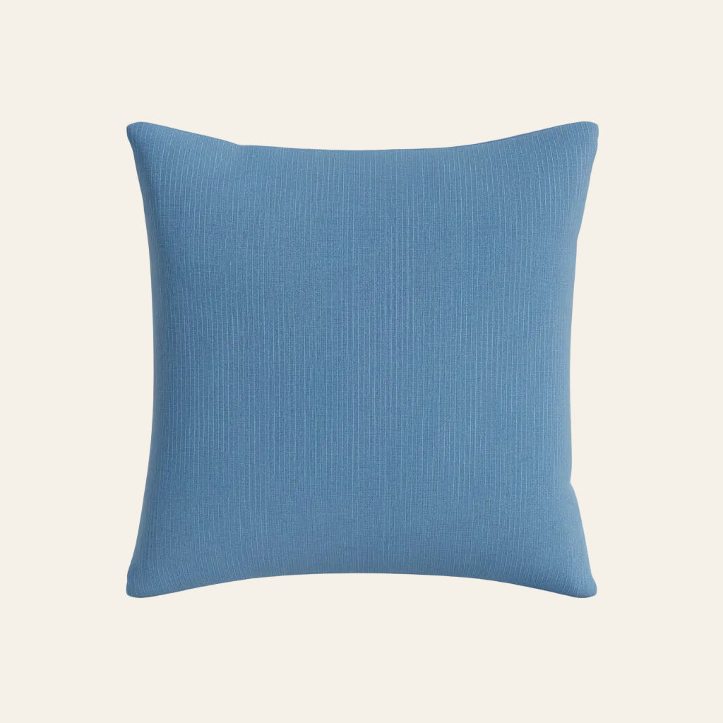 Ann Gish Lamina pillow in slate blue with subtle ribbed texture, square format.