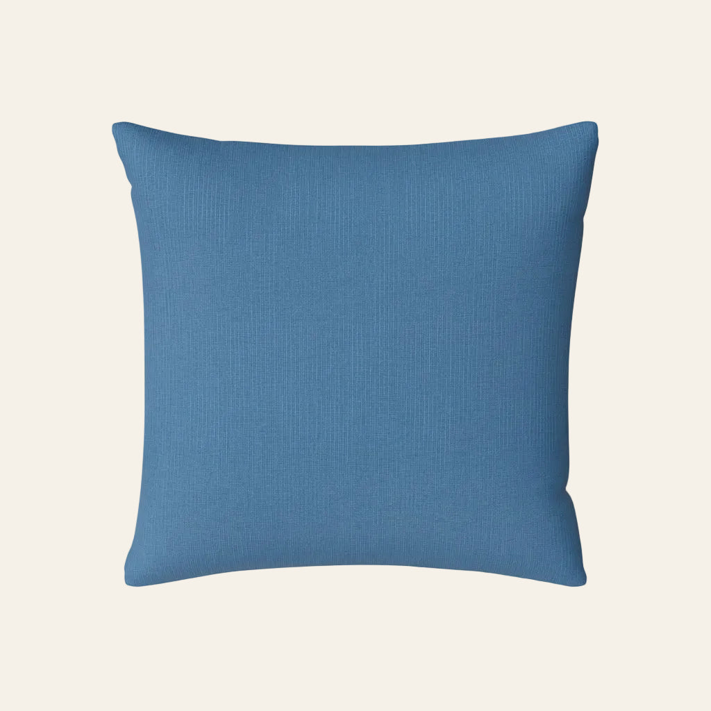 Ann Gish Lamina sham in steel blue with subtle ribbed texture, square format.