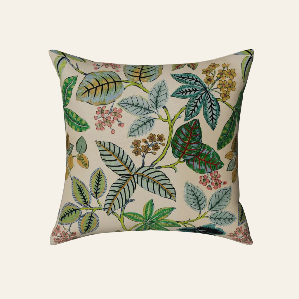Ann Gish Lanai pillow with botanical leaf and berry print on ivory linen ground.