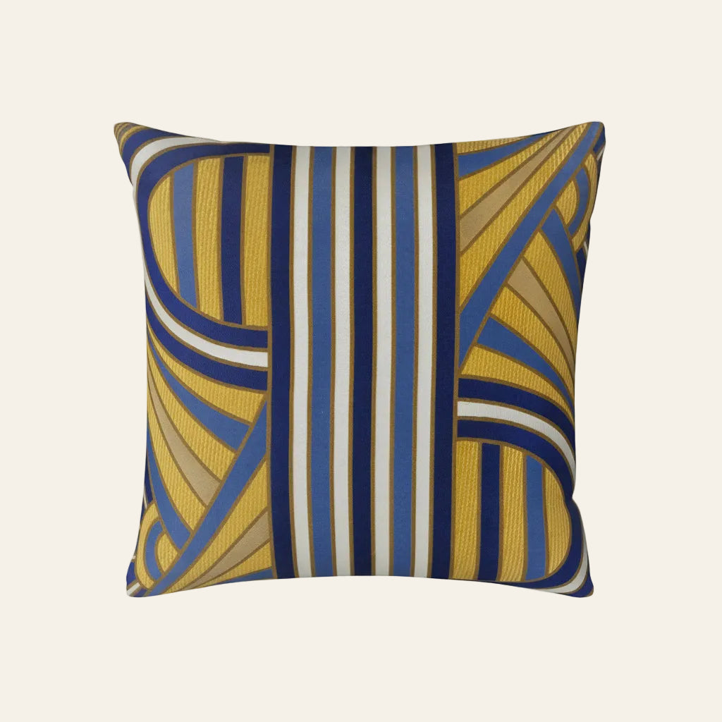 Ann Gish Lever Du Soleil pillow in gold and cobalt geometric stripe pattern.