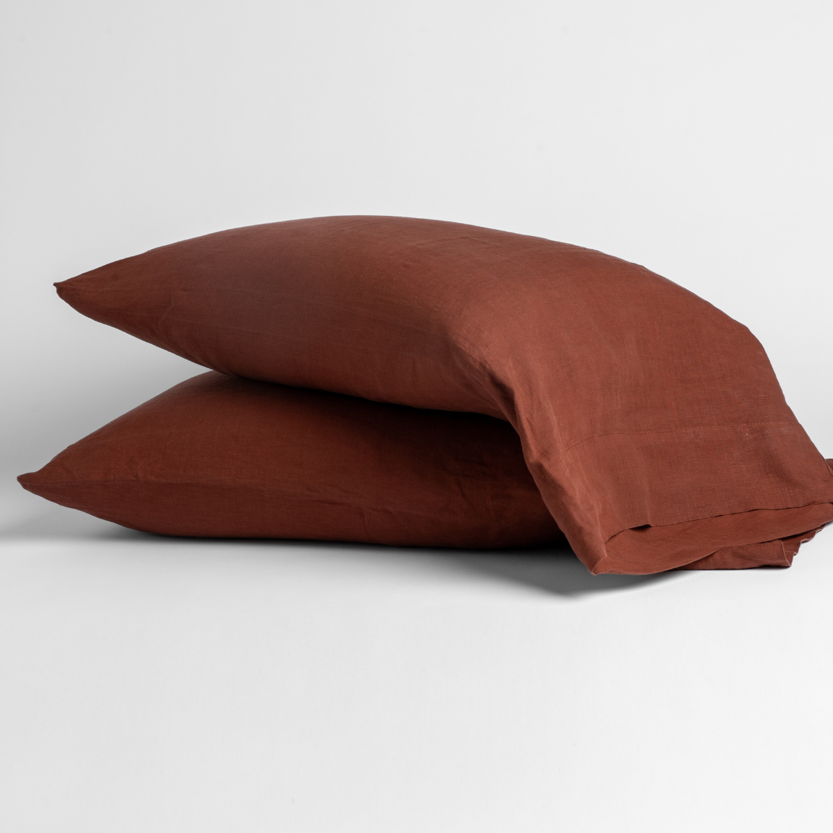 Two stacked Bella Notte Linen pillowcases in Autumn, shown against a neutral background.