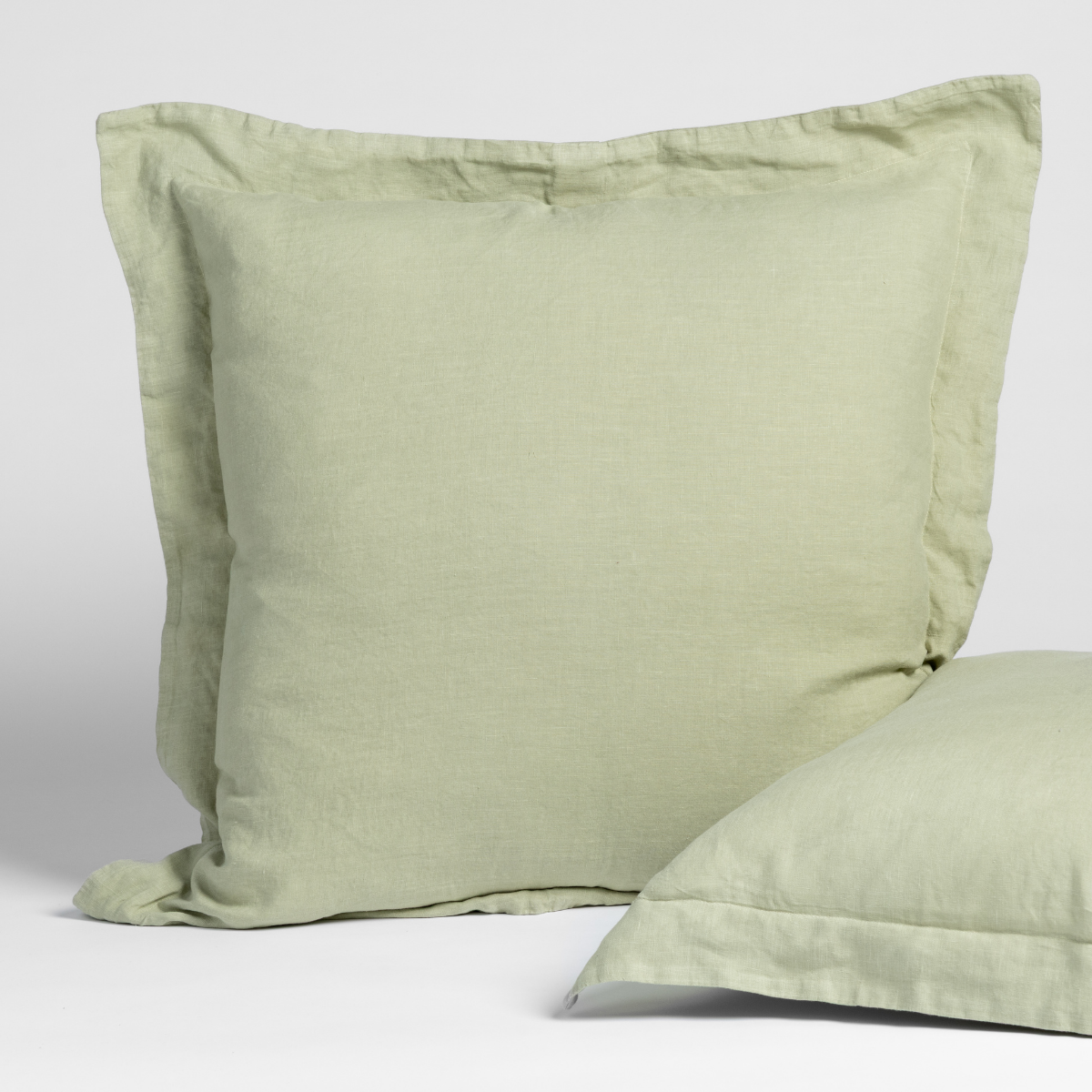 Desert Sage linen sham with flange border, second sham partially visible in foreground.