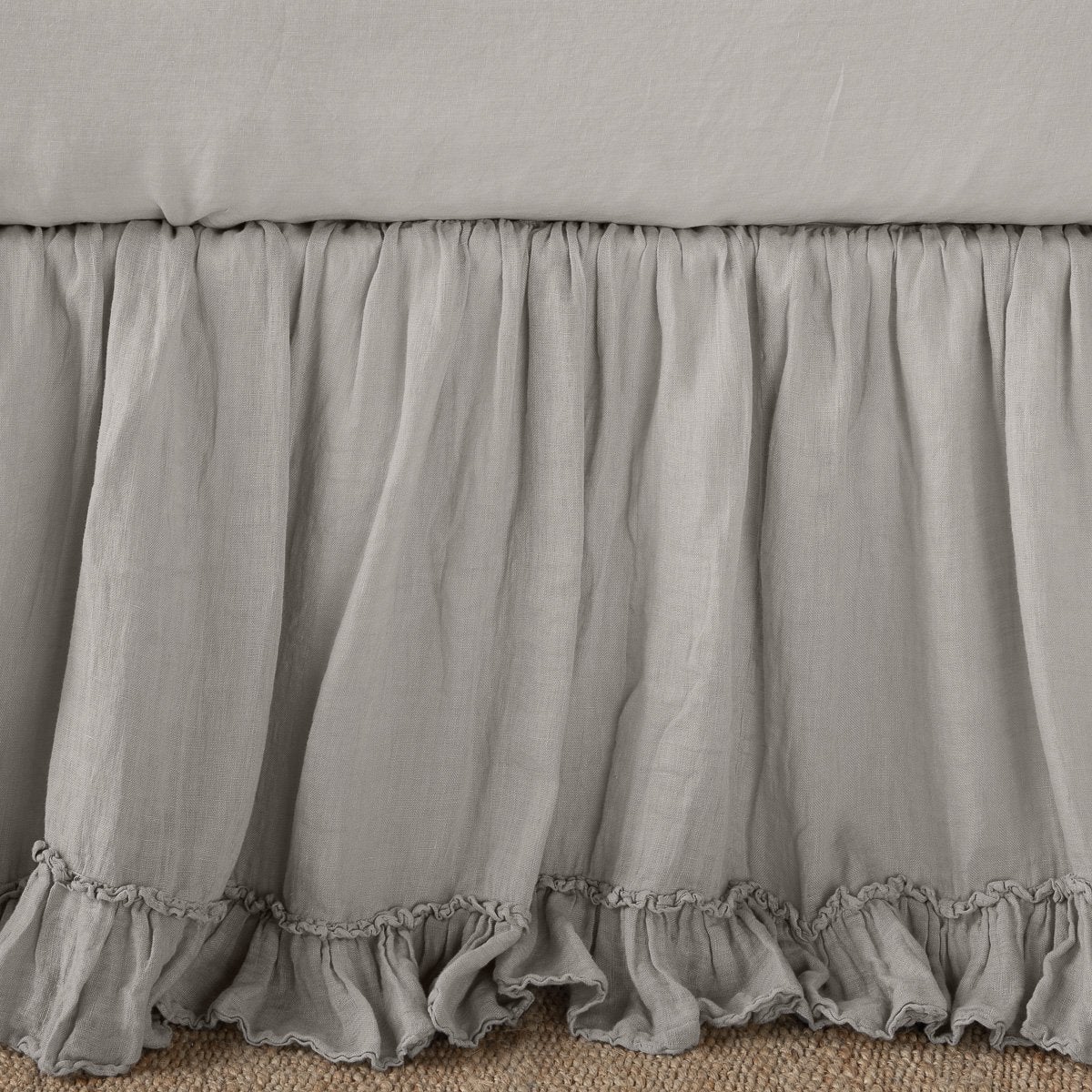 Ruffled hem detail on Bella Notte Linen Whisper bed skirt in Fog.