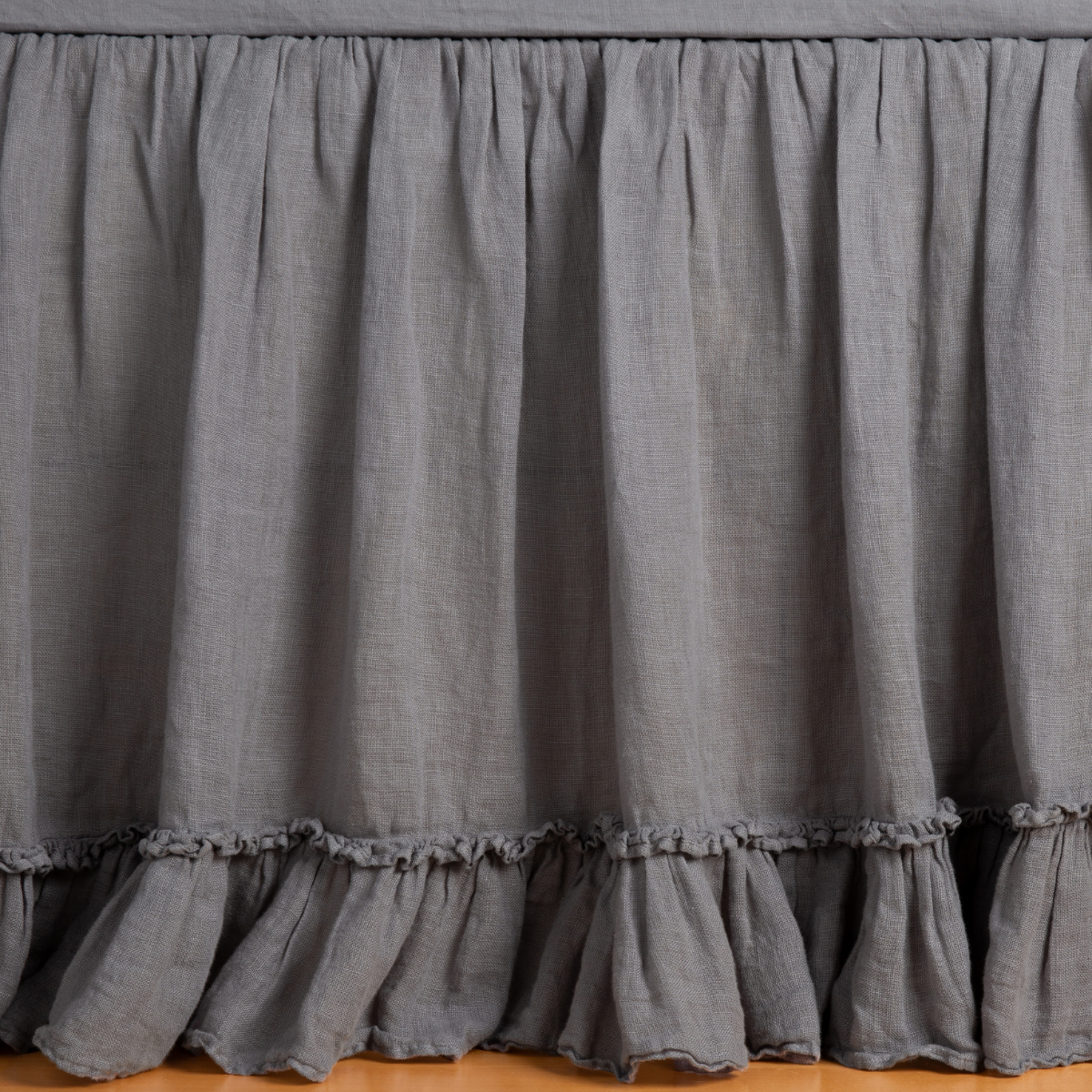 Bella Notte Linen Whisper bed skirt in French Lavender, double ruffle hem detail closeup.