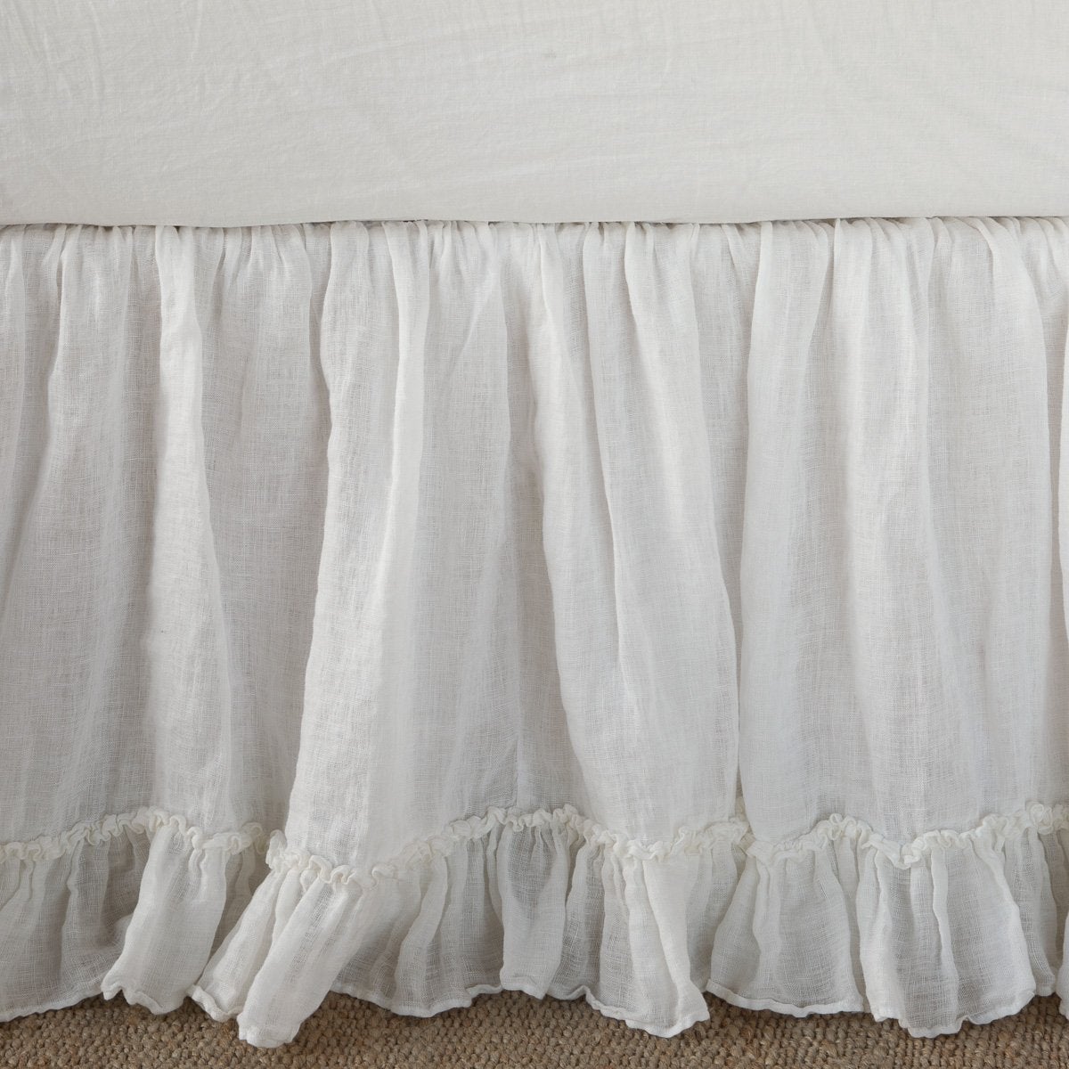 Ruffled hem detail on Bella Notte Linen Whisper bed skirt in Winter White.