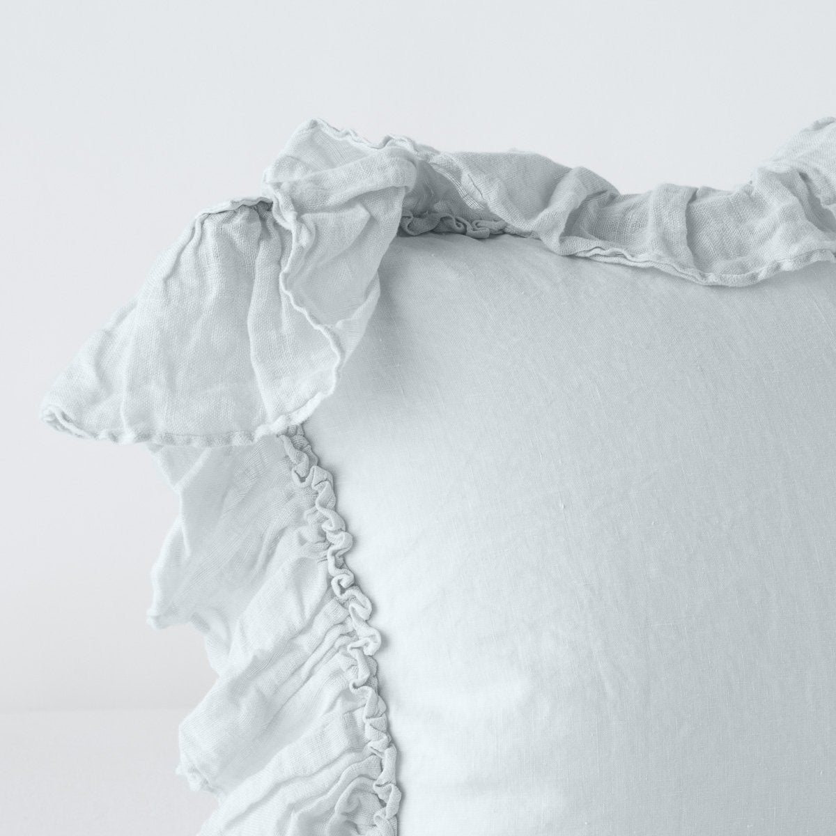 Close-up of Cloud ruffled trim detail on Bella Notte Linen Whisper sham corner.