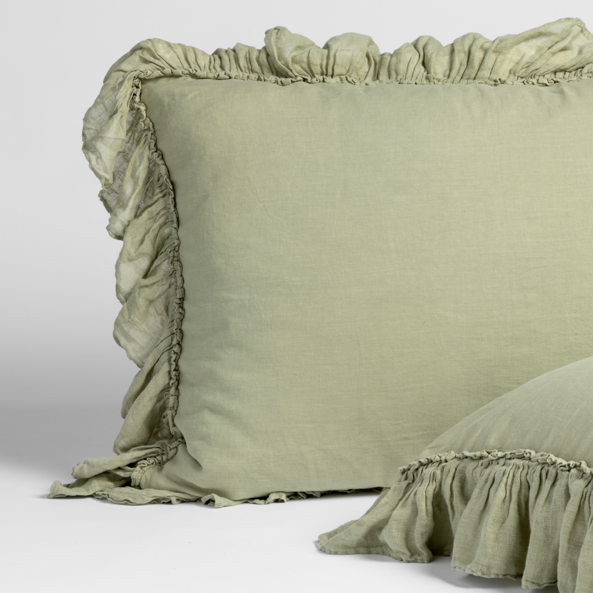 Bella Notte Linen Whisper sham in Desert Sage, ruffled edge detail shown close up.