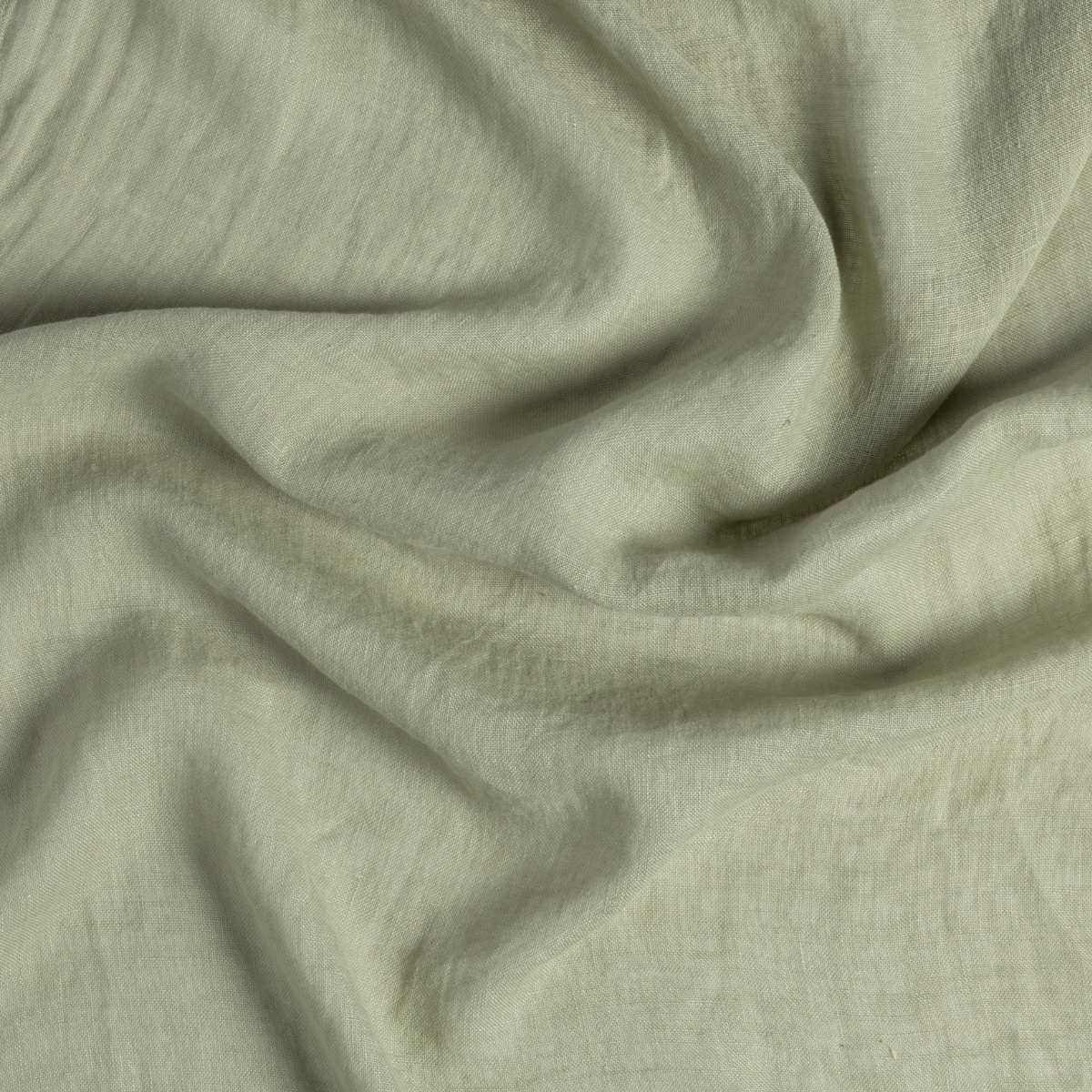 Close-up of Desert Sage Bella Notte Linen Whisper fabric showing soft drape and texture.