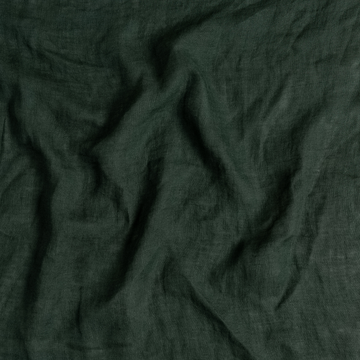 Close-up of Juniper Linen Whisper fabric showing relaxed drape and natural linen weave texture.