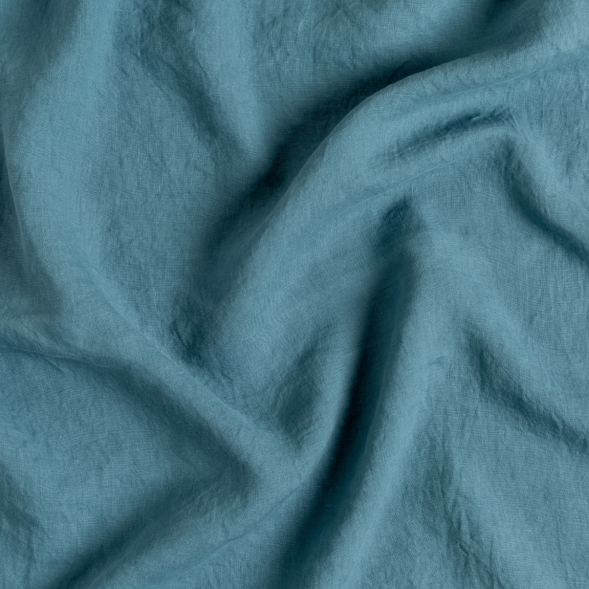 Close-up of Cenote linen fabric with soft draping and natural wrinkled texture.