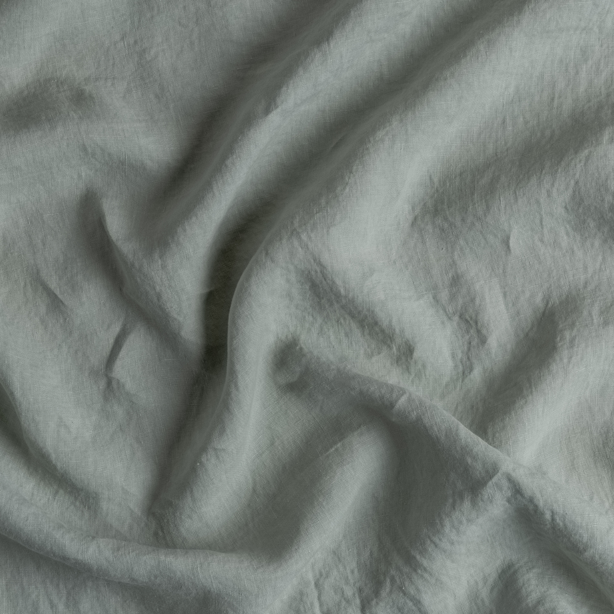 Close-up of Bella Notte Frida guest towel in Eucalyptus, showing soft draped linen texture.