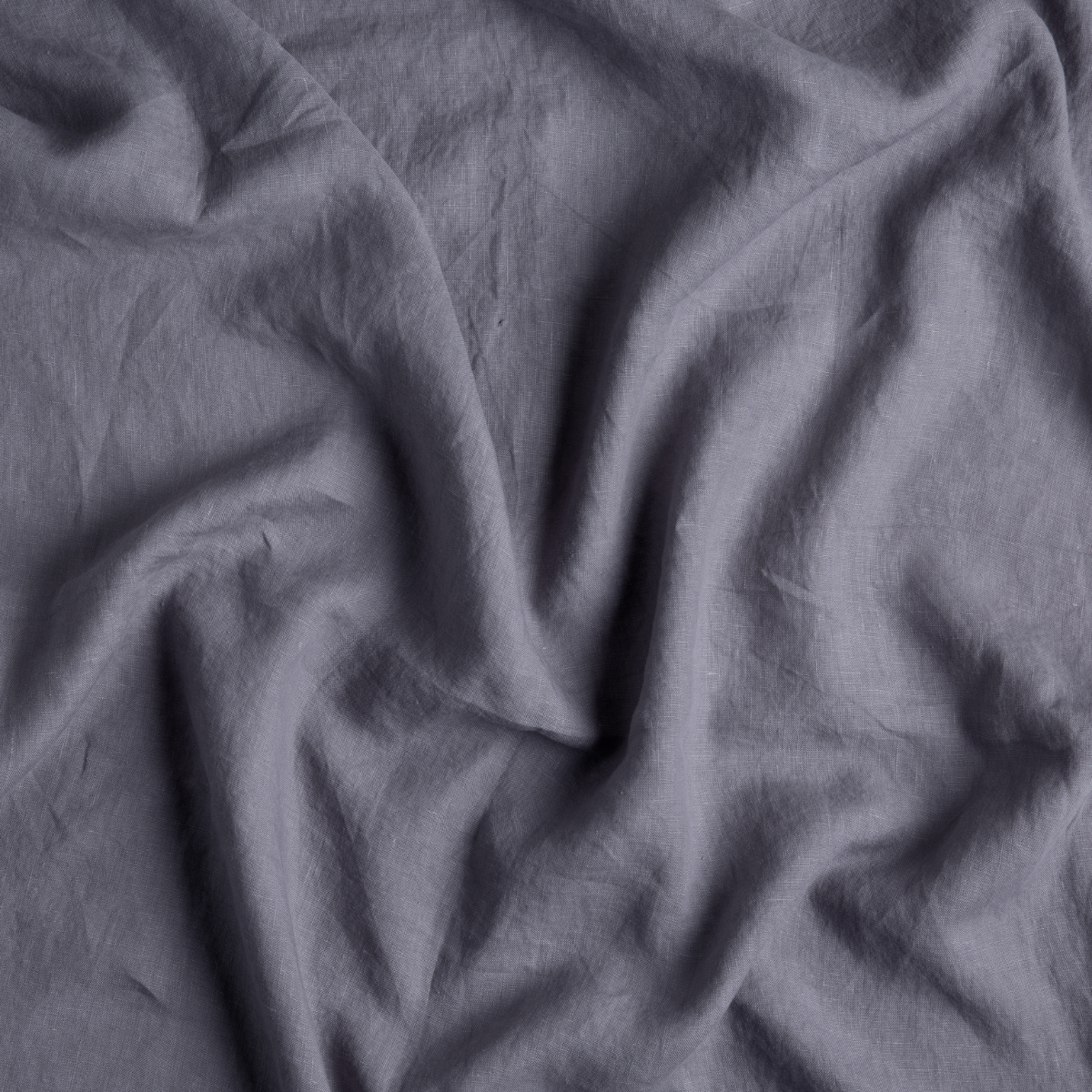 Close-up of French Lavender linen flat sheet showing relaxed, natural drape and texture.