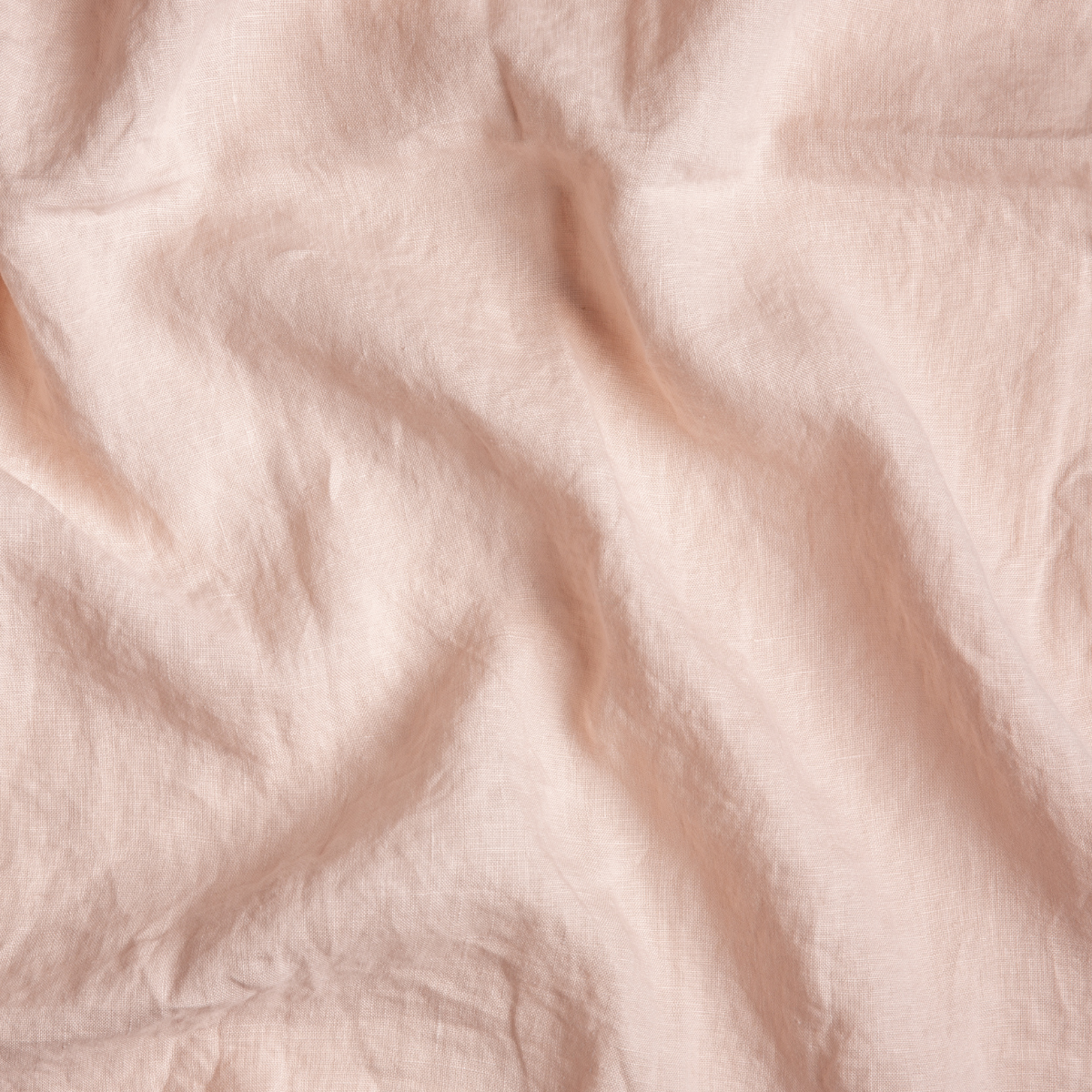 Close-up of Pearl Bella Notte linen flat sheet showing soft drape and natural wrinkled texture.
