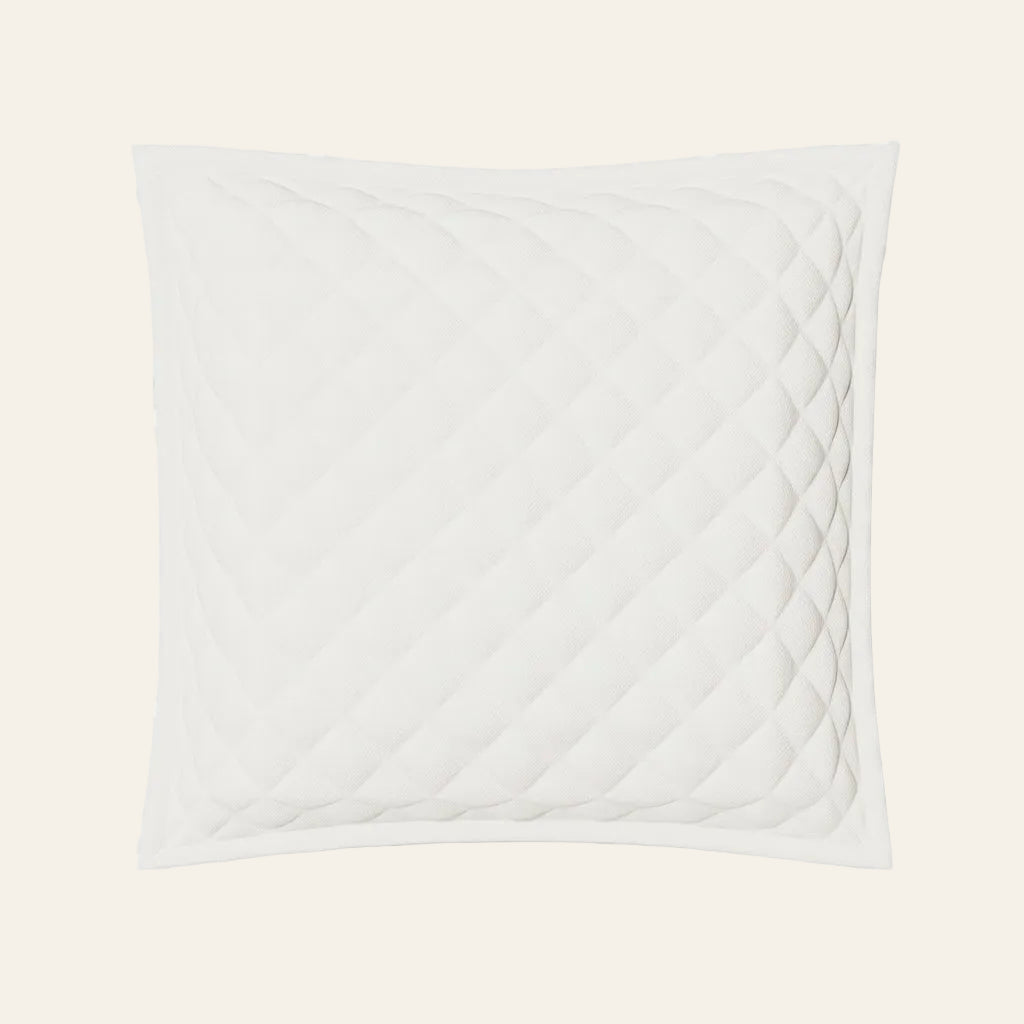 Ann Gish Linen Quilted Pillow in white with diamond quilting pattern and border trim.