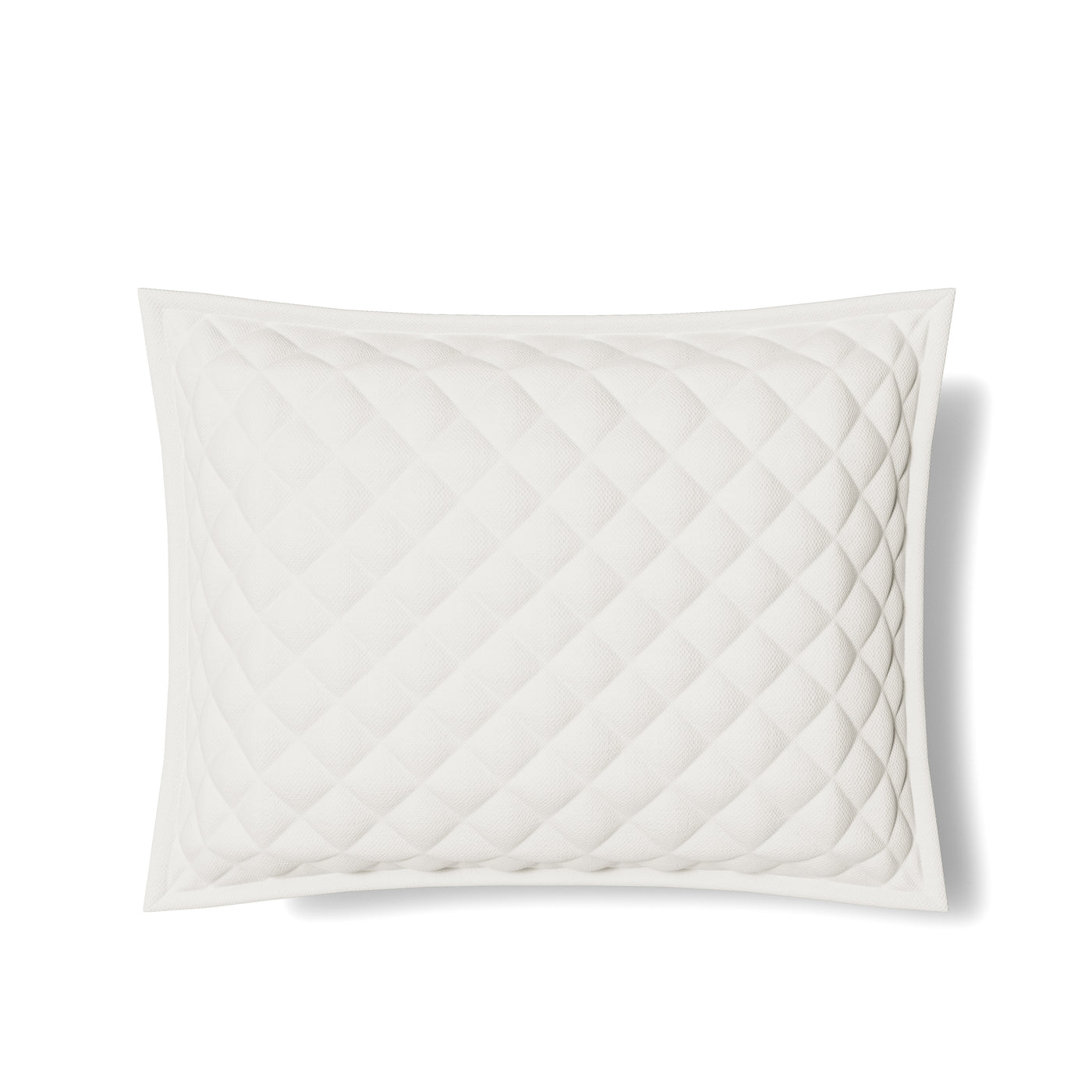 Close-up of Ann Gish Linen quilted sham showing ivory diamond-pattern stitching detail.