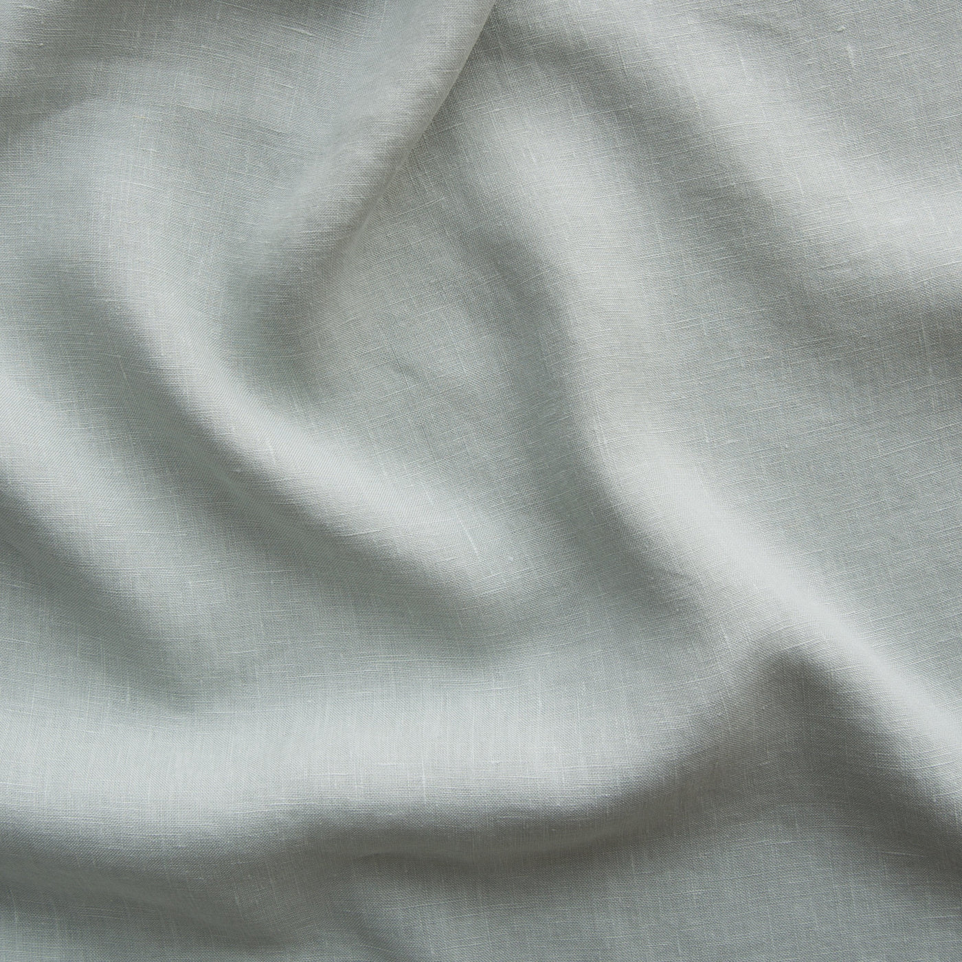 Close-up of Eucalyptus linen fabric showing soft drape and natural woven texture.