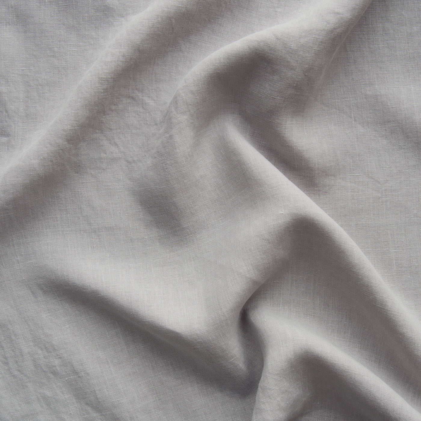 Close-up of Fog linen fabric showing soft drape and natural washed texture.