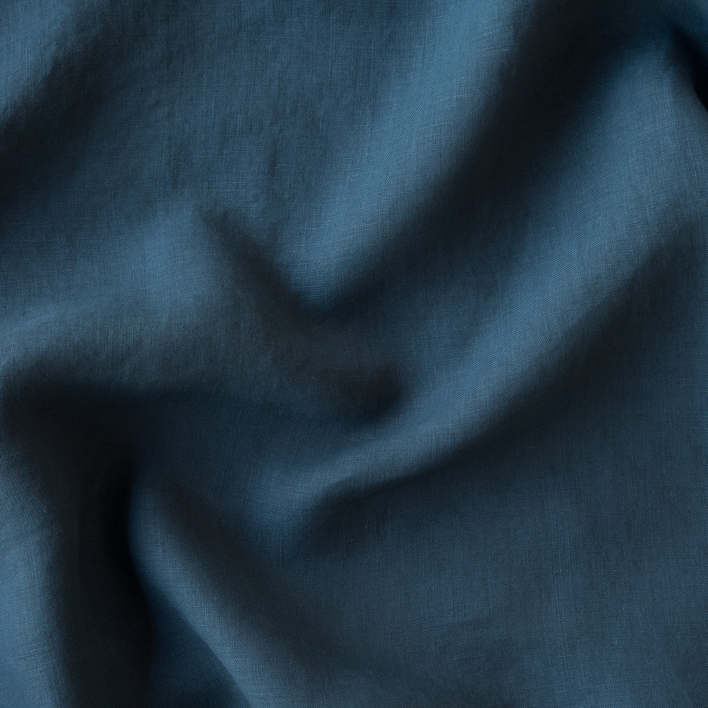 Close-up of Bella Notte Midnight linen fabric showing soft drape and texture.