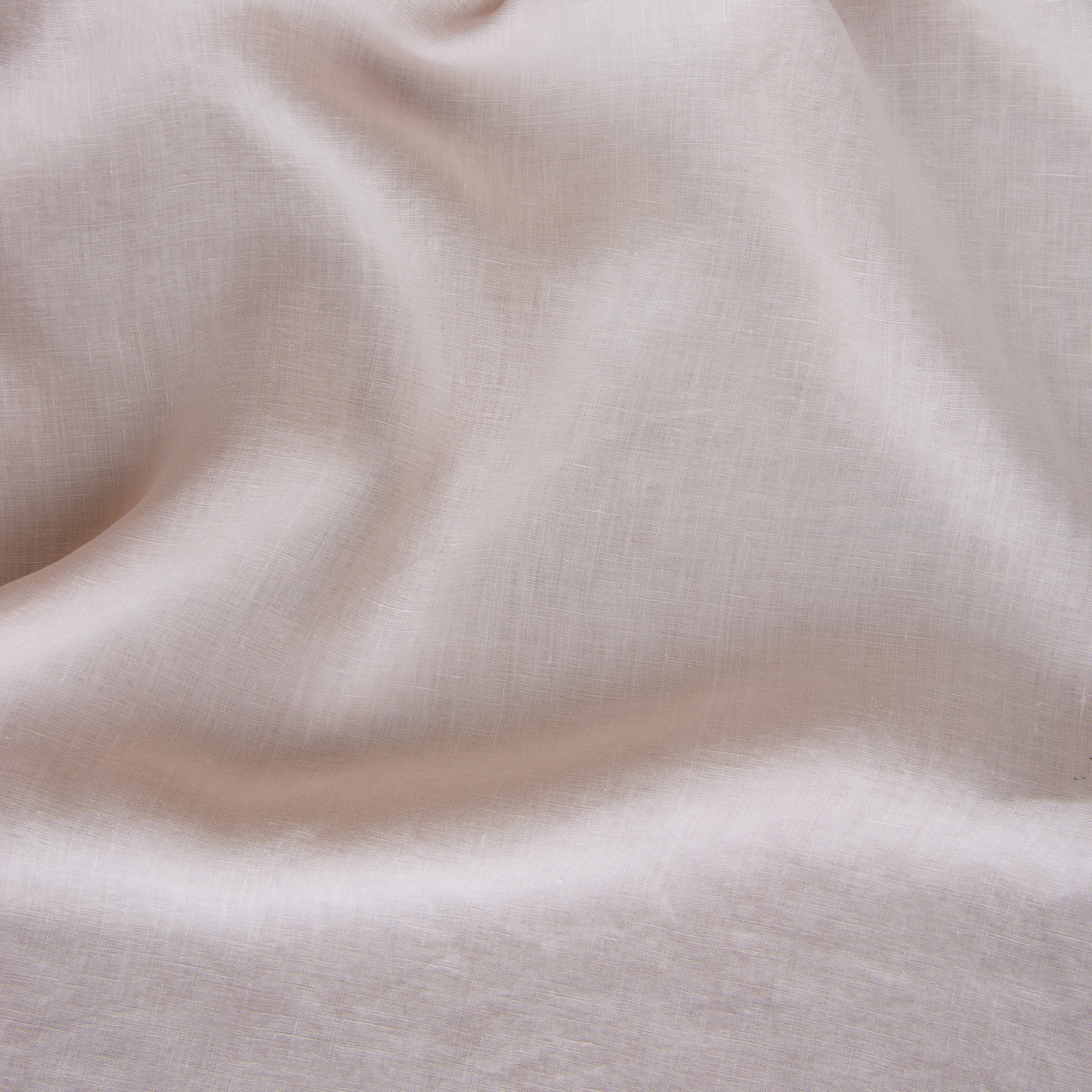 Close-up of Pearl linen fitted sheet fabric, showing soft drape and fine woven texture.